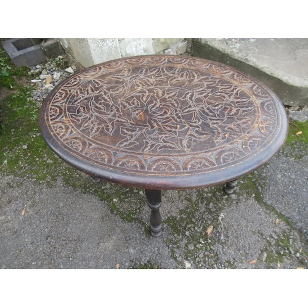 An oak coffee table with carved decoration
