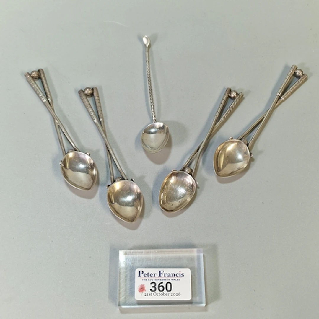 Set of four silver presentation spoons, gold themed with clu...
