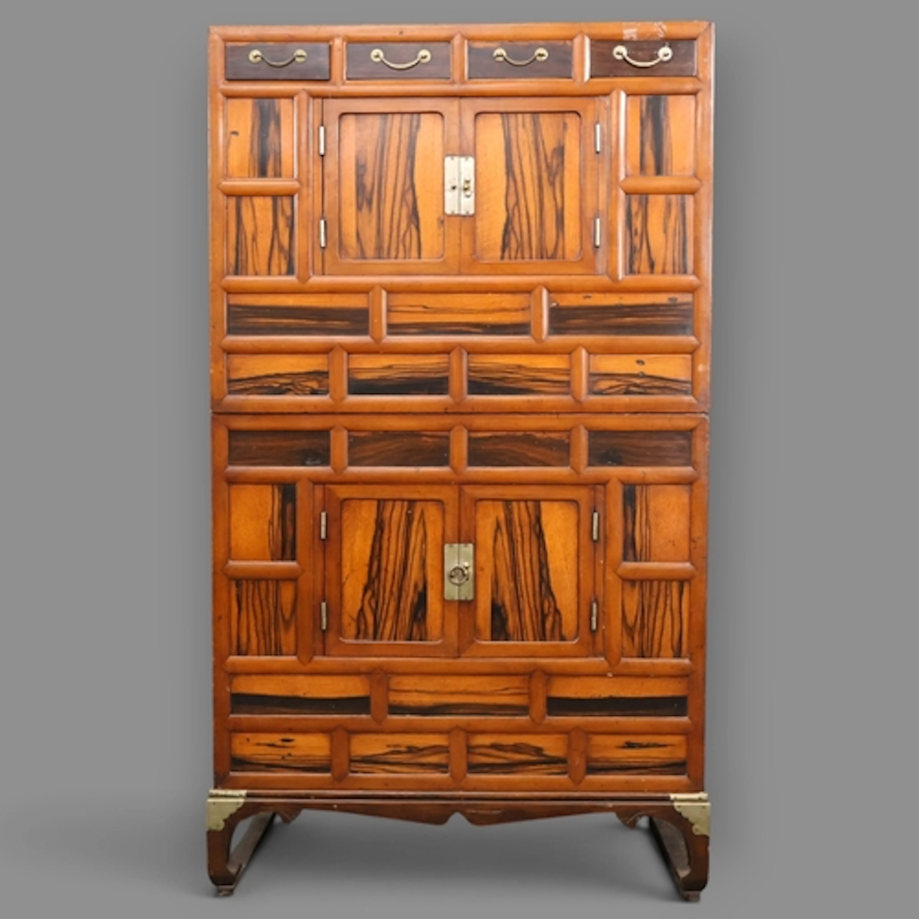 An antique Korean elm two-section Tansu chest. W83cm, H145cm...