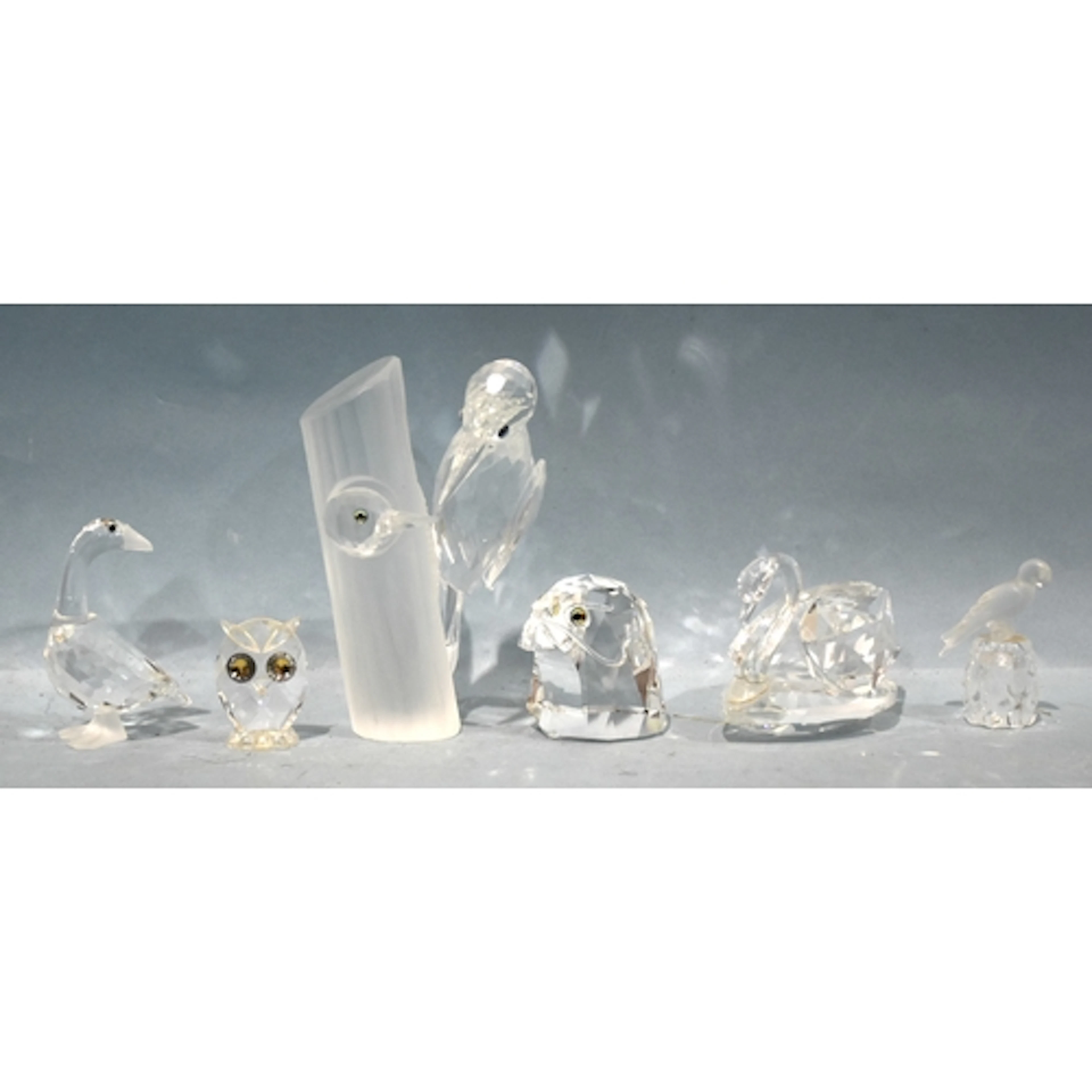 Swarovski, a collection of unboxed bird figures: adult woodp...