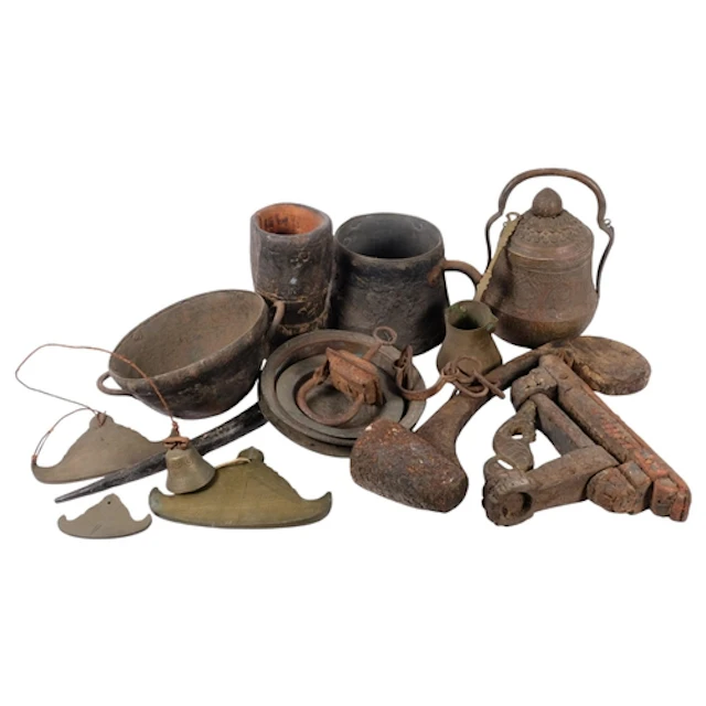A box of various wooden and metal Tribal ware, buckets, ladl...