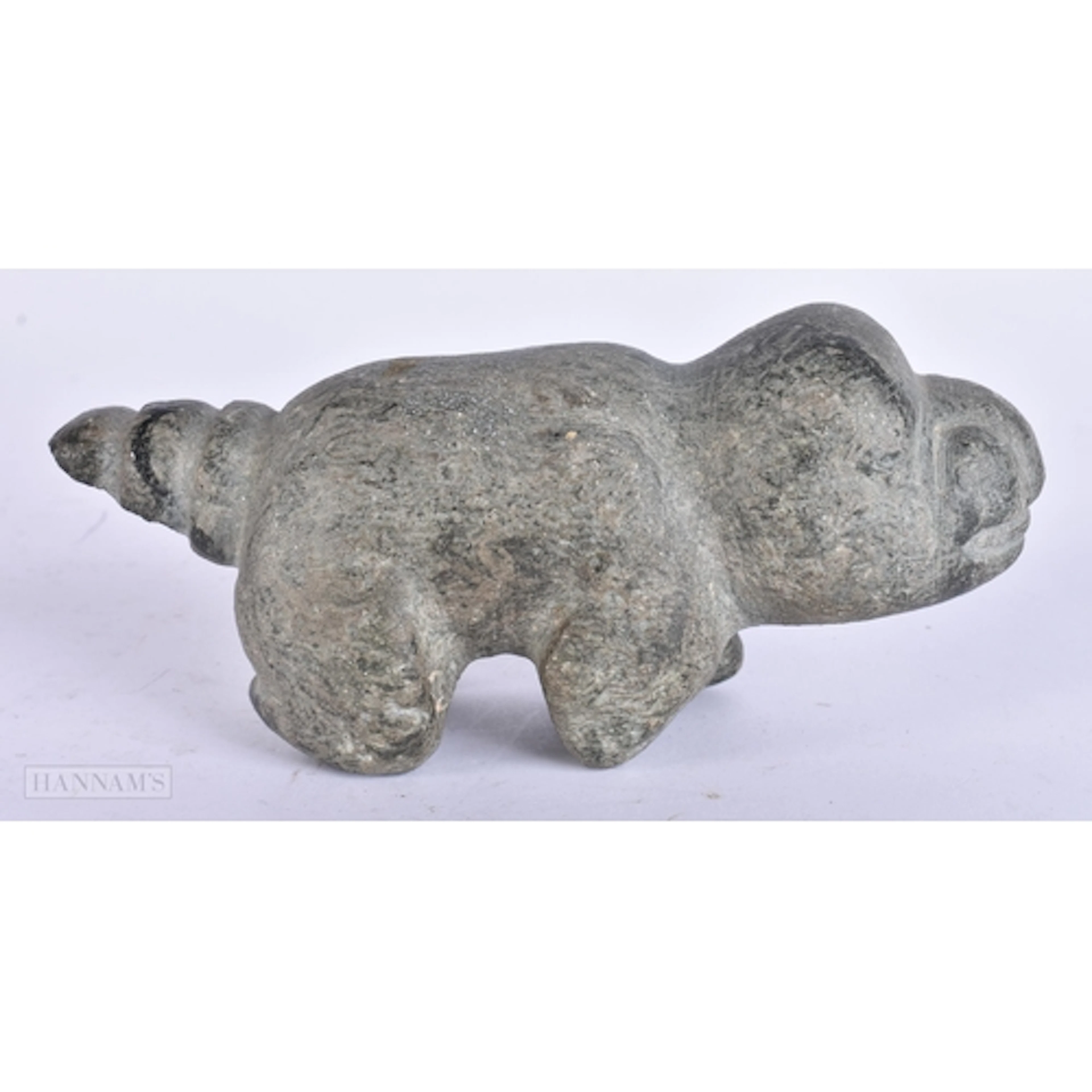 AN UNUSUAL EARLY SOUTH AMERICAN TRIBAL CARVED STONE BEAST. 1...