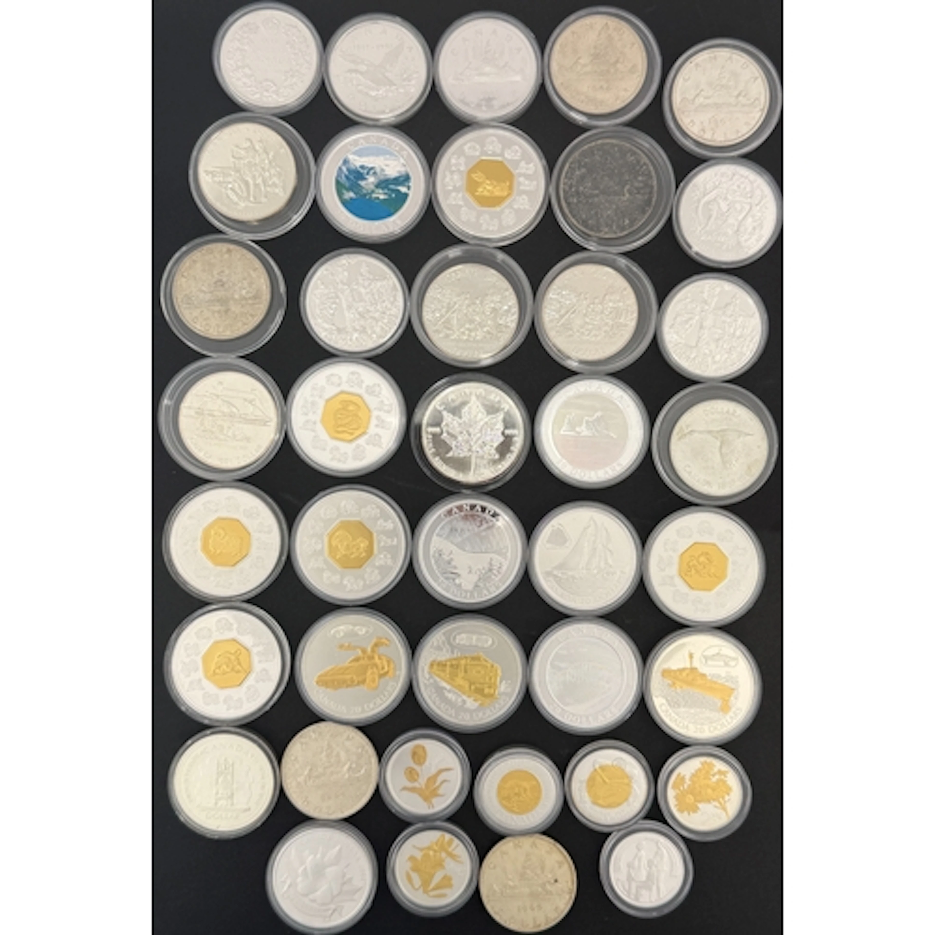 A collection of 38 Canadian silver coins, comprising 50 Cent...