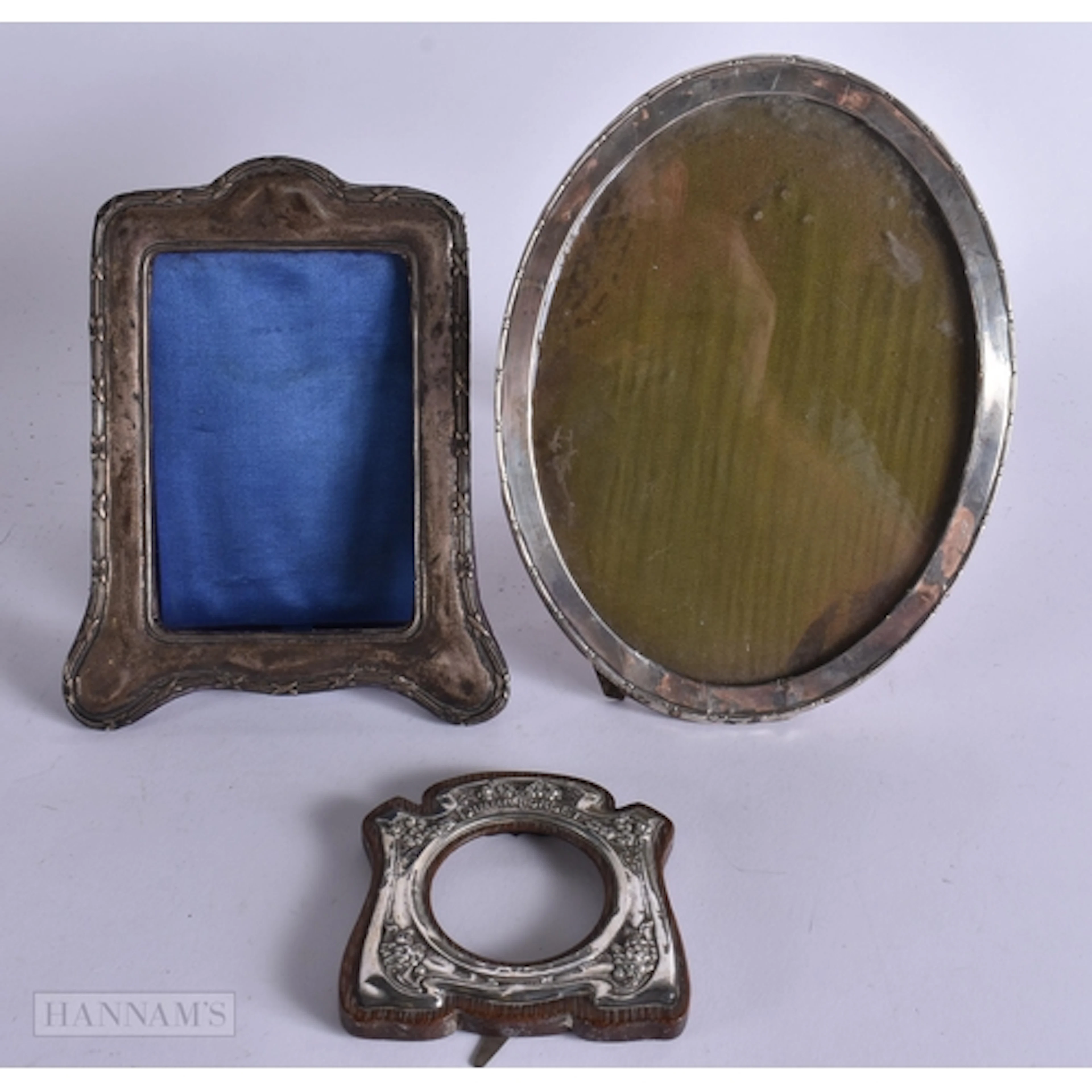 THREE ANTIQUE SILVER PHOTOGRAPH FRAMES. Largest 21 cm x 12 c...