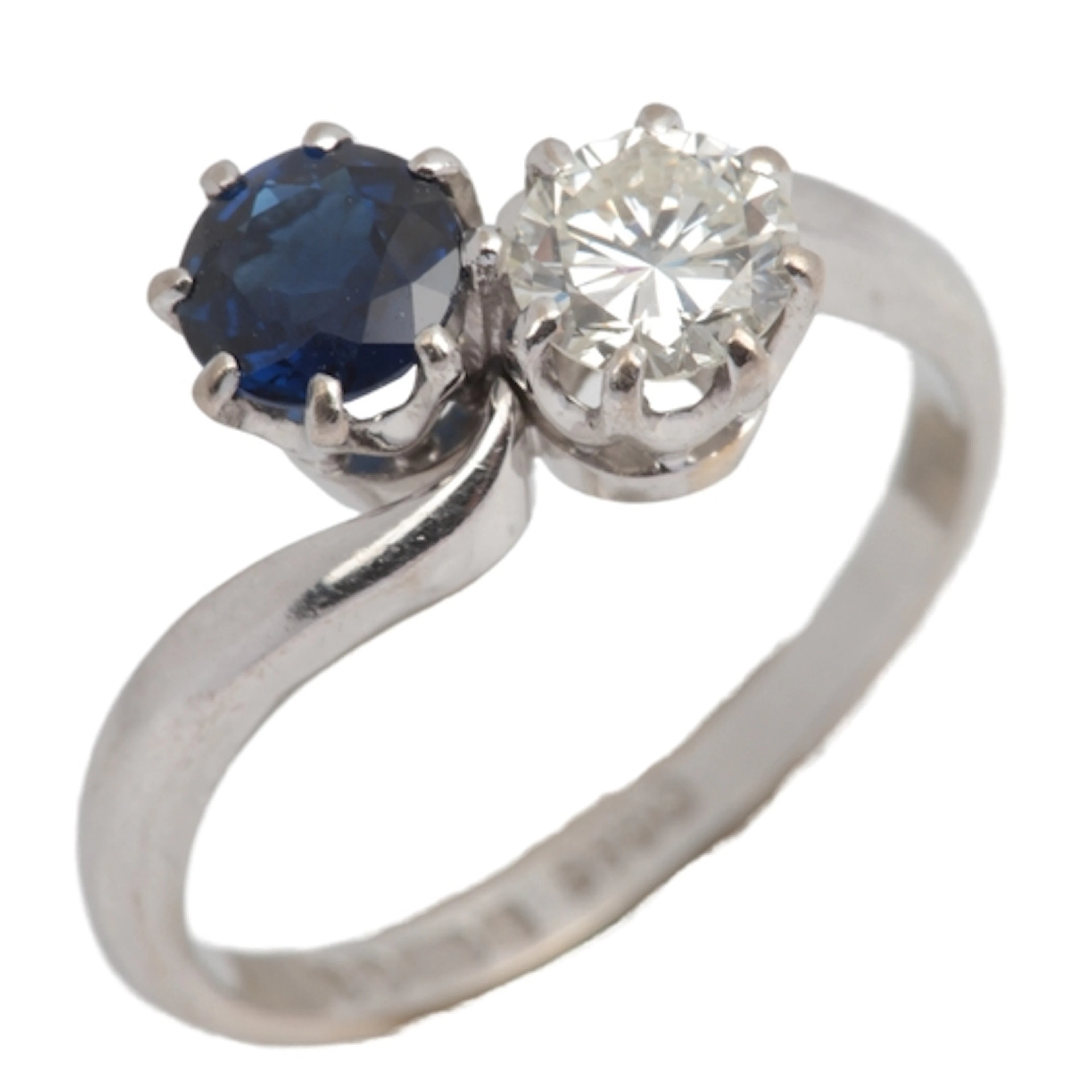 A sapphire and diamond toi-et-moi ring, circa 1977, claw-set...