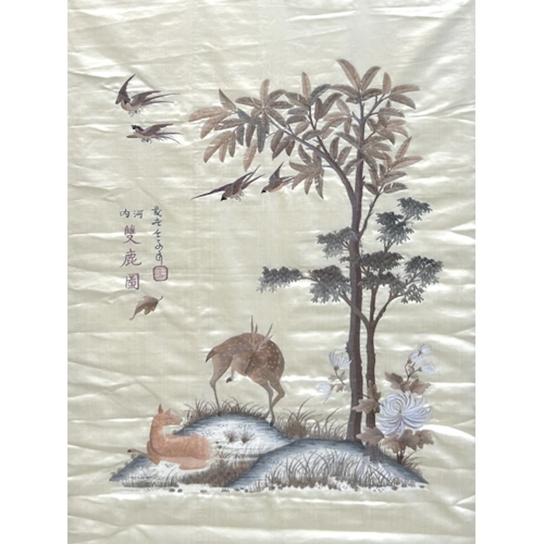 A CHINESE SILK EMBROIDERY OF TWO DEER BENEATH A TREE 78cm x ...