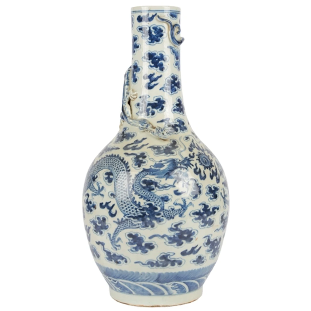 A tall Chinese blue and white 'dragon' bottle vase, 19th cen...