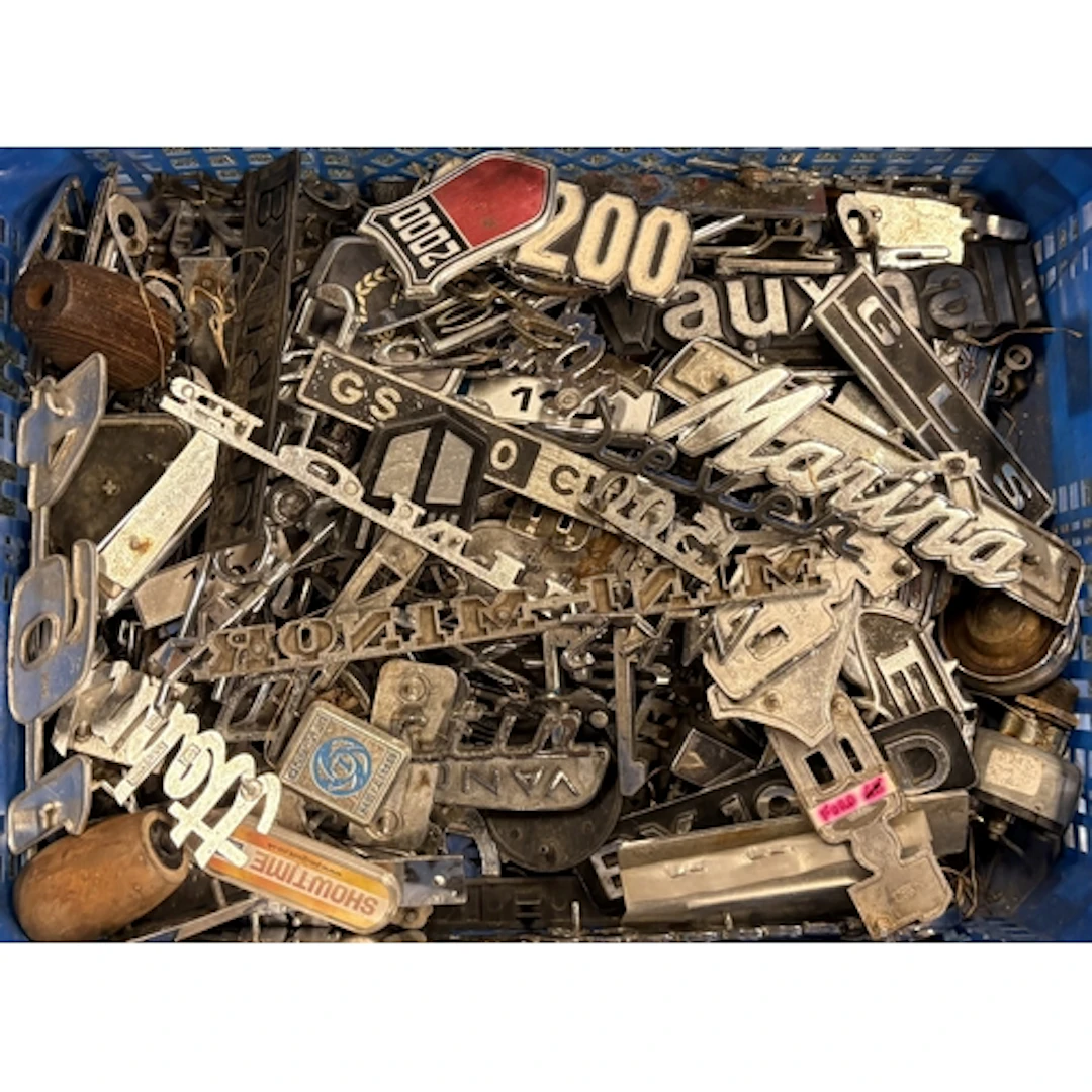 A collection of vintage motorcar badges. Est. £20 - £30.