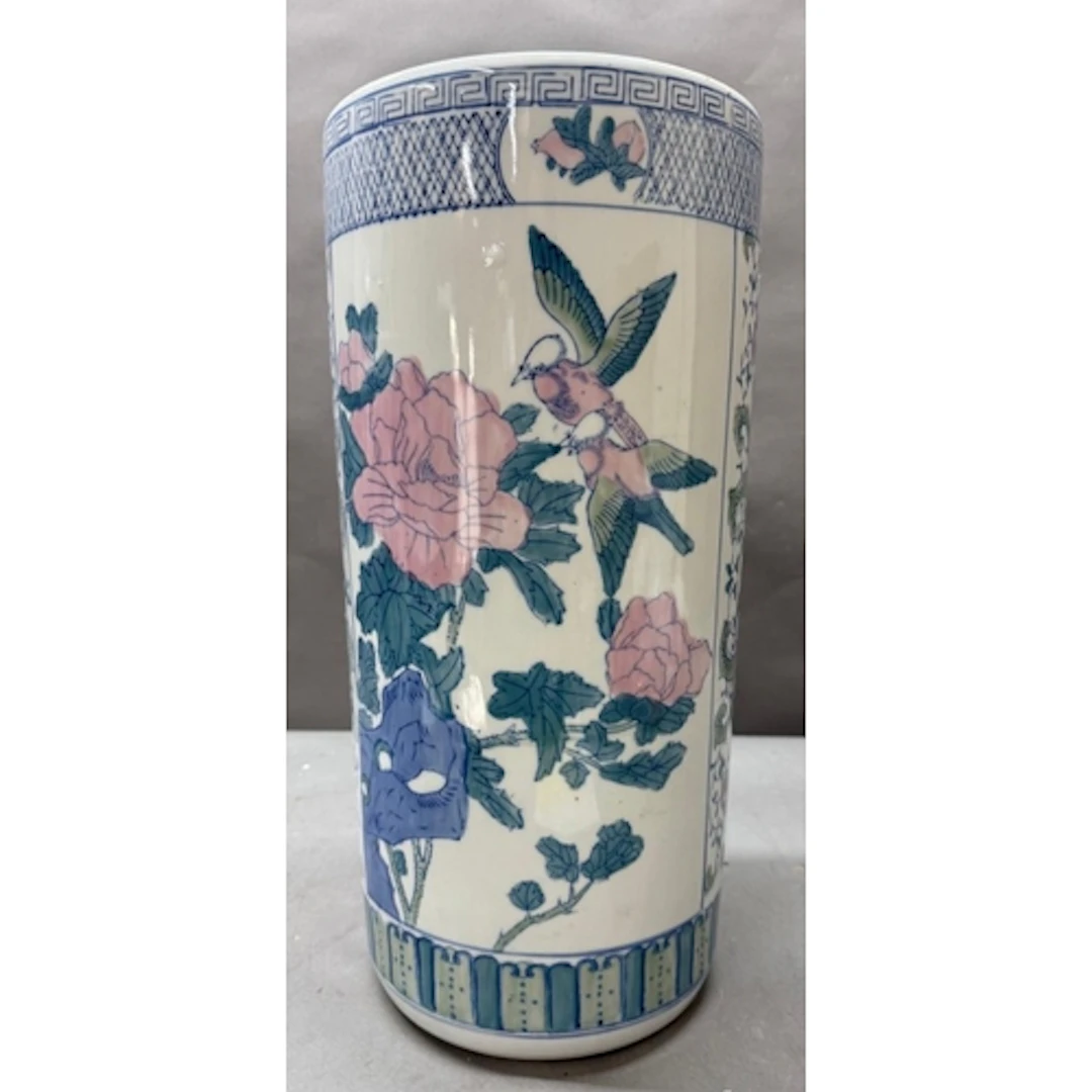 A Chinese ceramic umbrella stand with floral decoration. Hei...