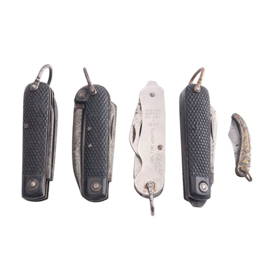 A group of four Royal Navy jack knives and a Spanish white a...