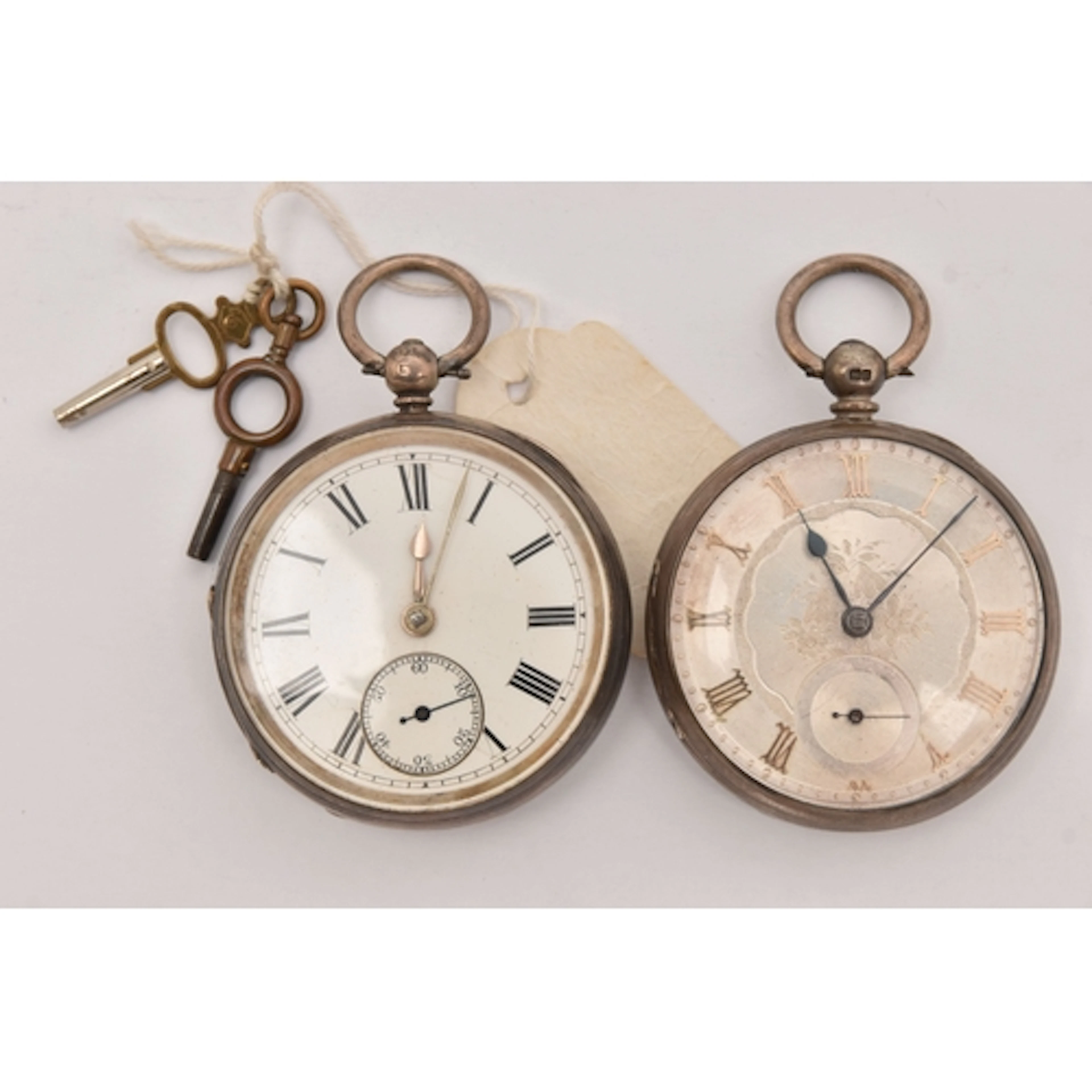 TWO SILVER OPEN FACE POCKET WATCHES, the first a key wound m...