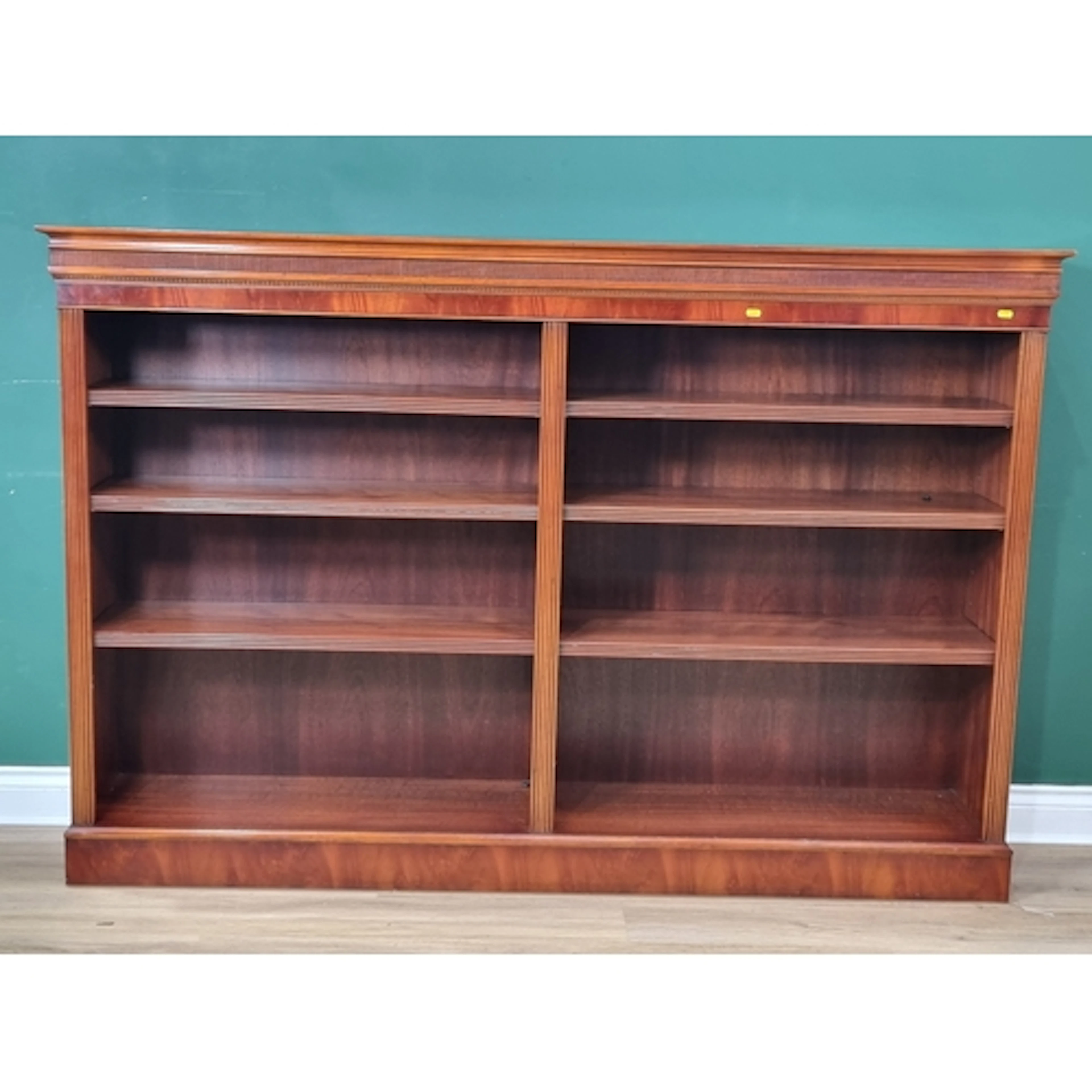 A reproduction mahogany double Bookcase with six adjustable ...