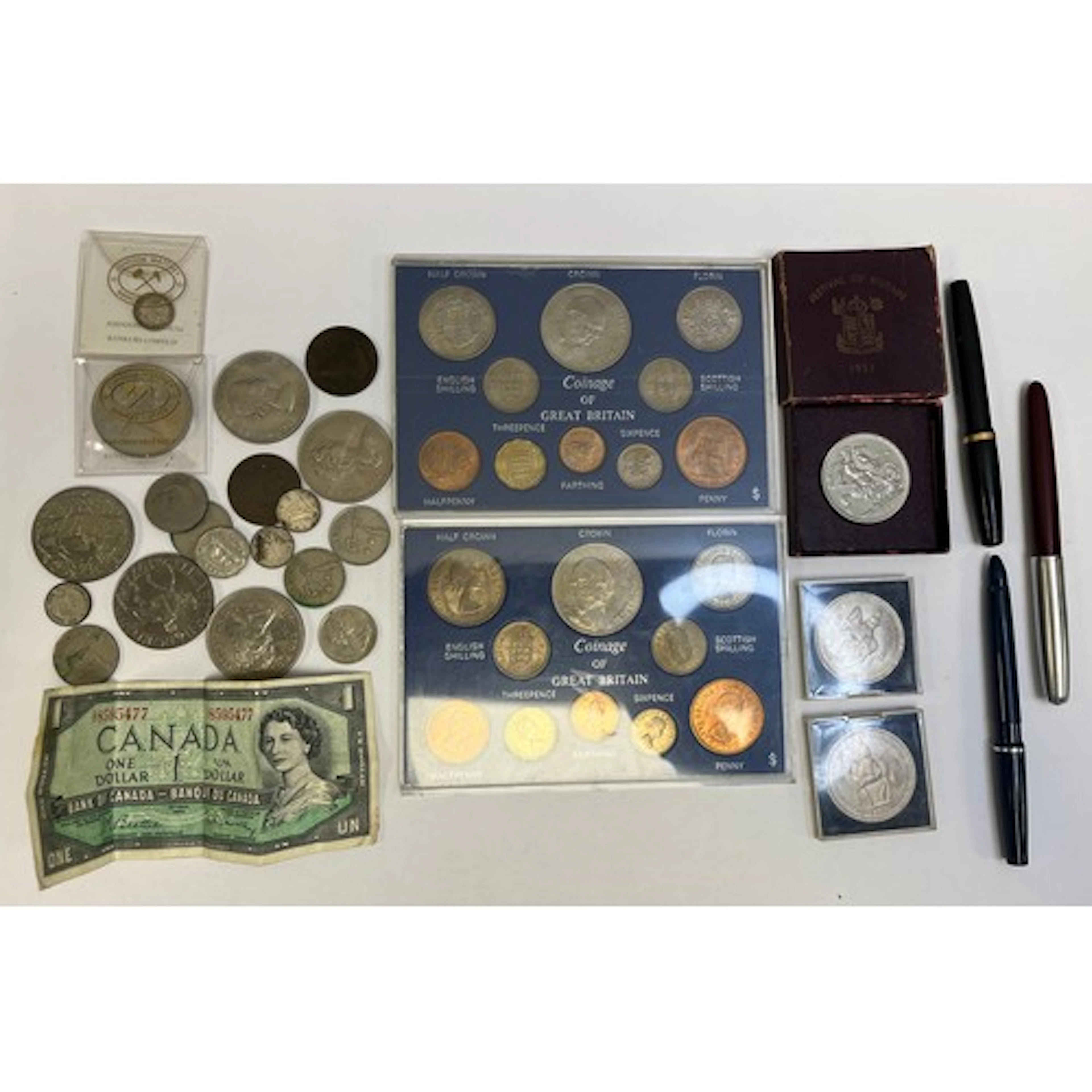 Assorted British coins sets, crowns etc.