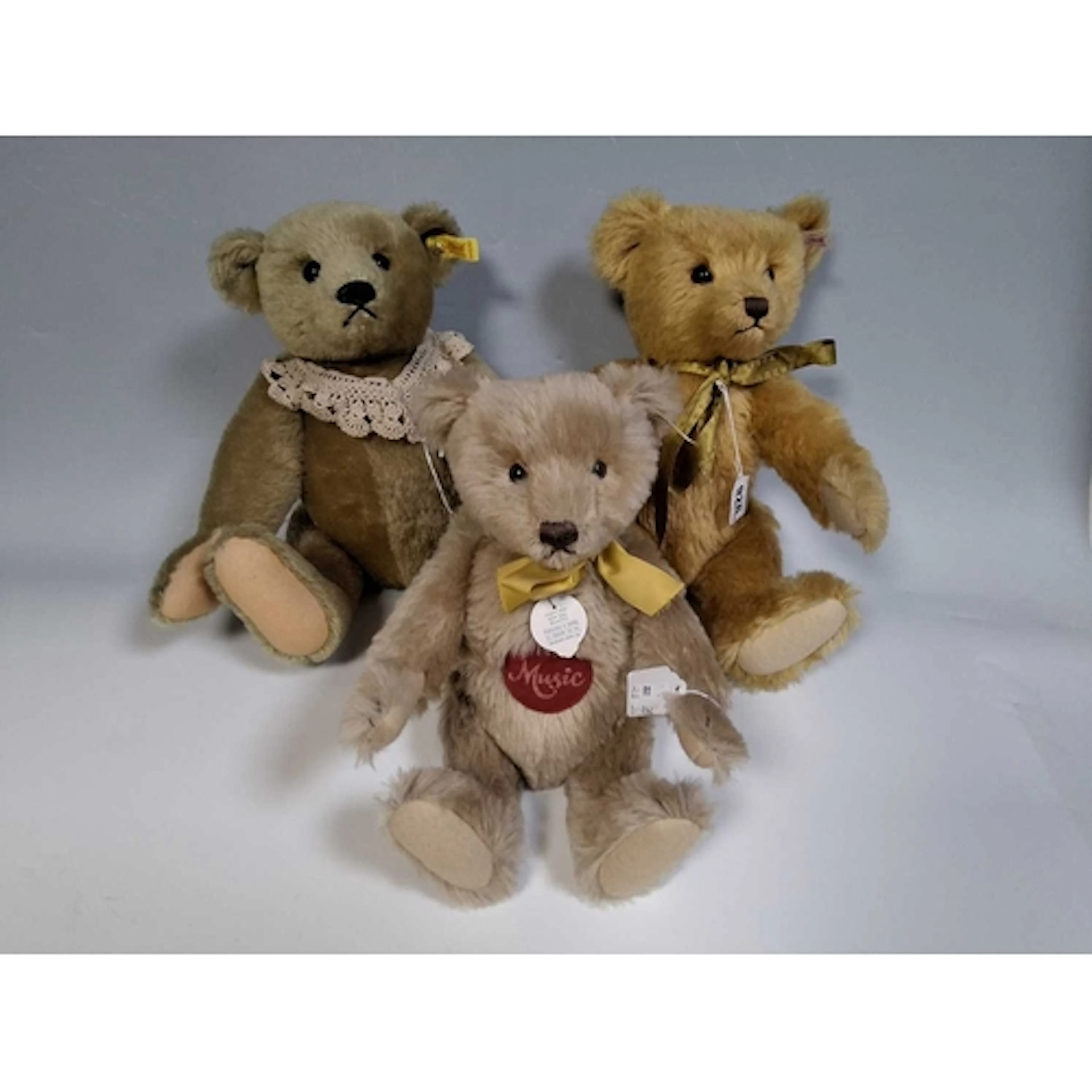 THREE STEIFF TEDDY BEARS comprising a Musical Teddy 1951 Car...
