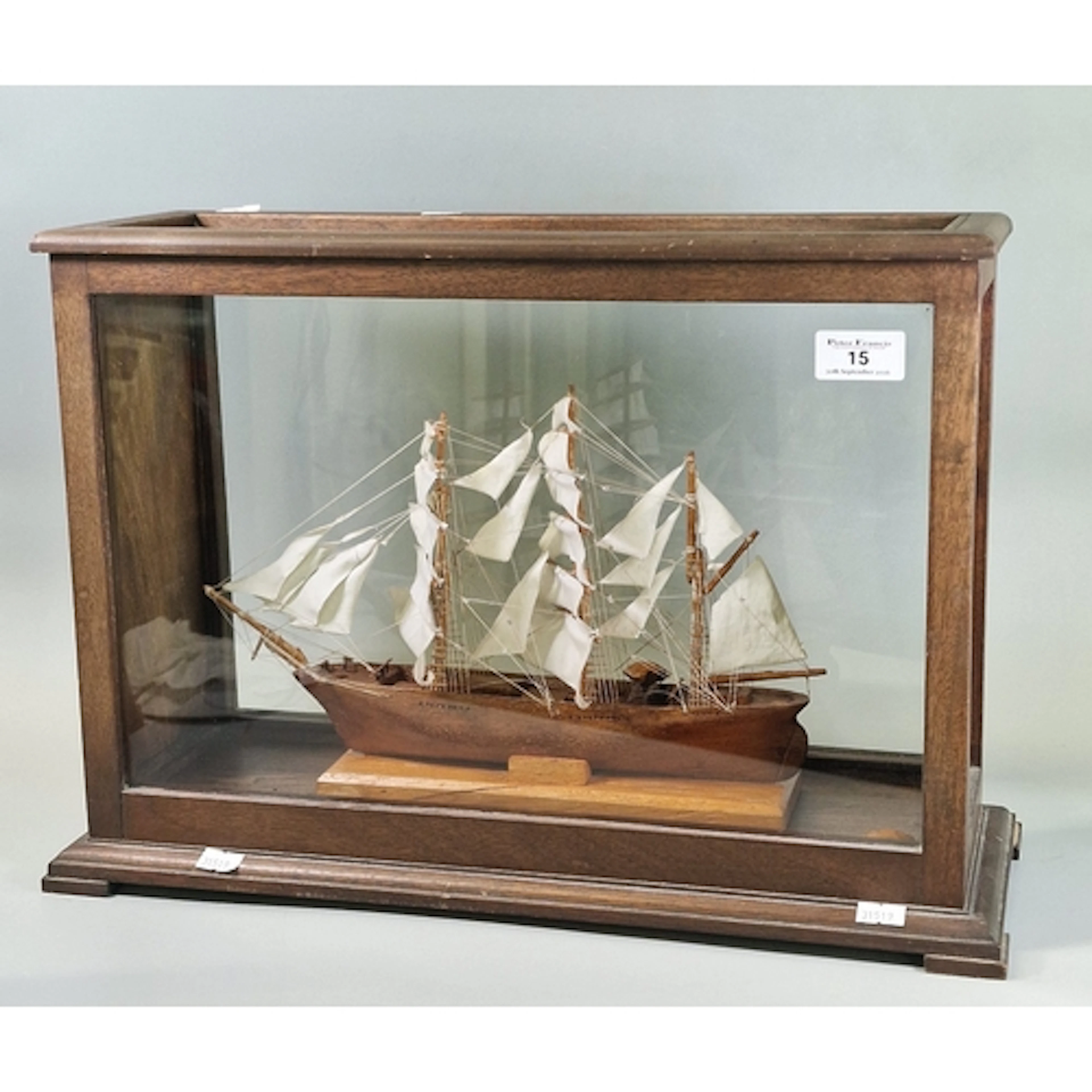 Wooden three masted sailing ship model in rectangular glass ...