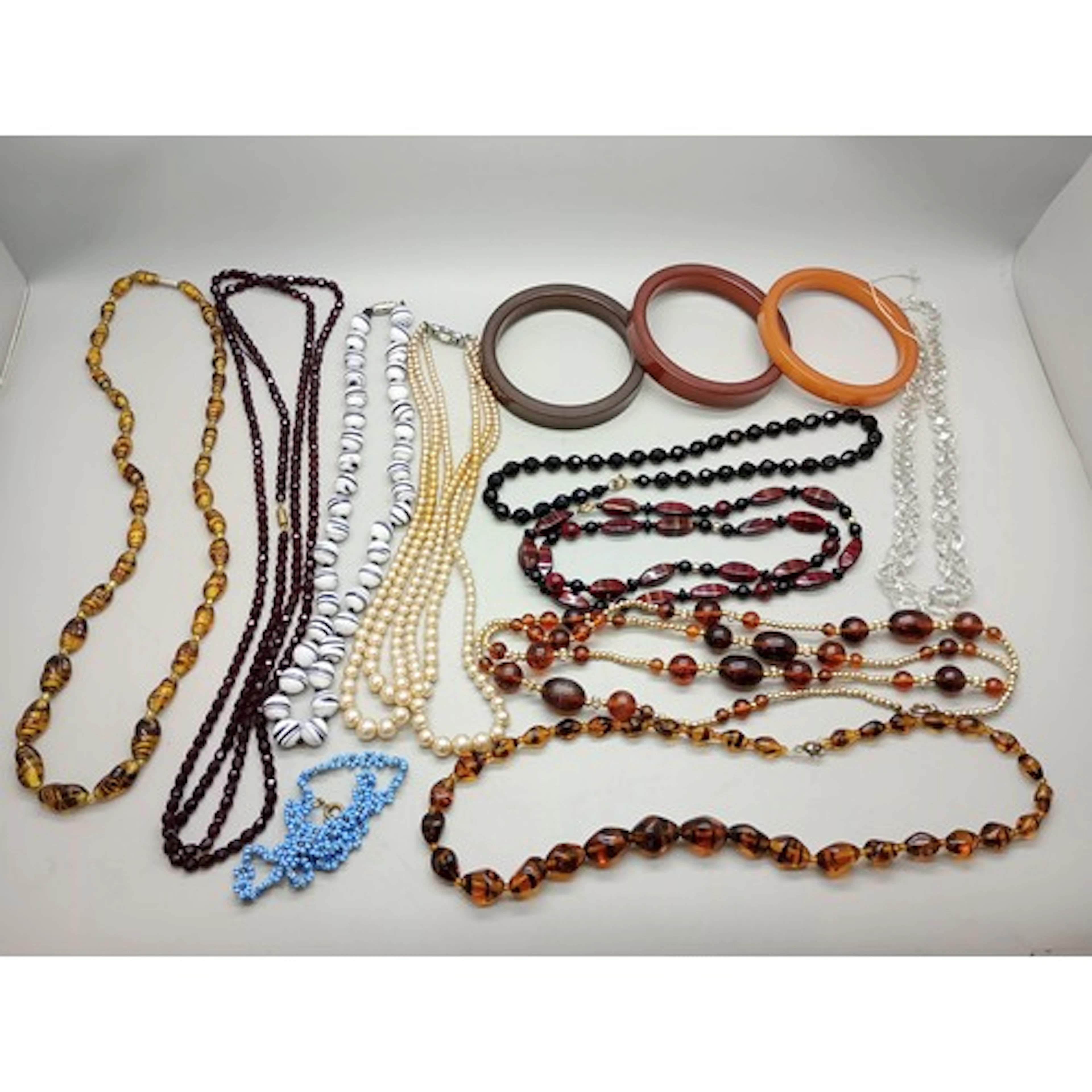 A collection of vintage necklaces and three bangles