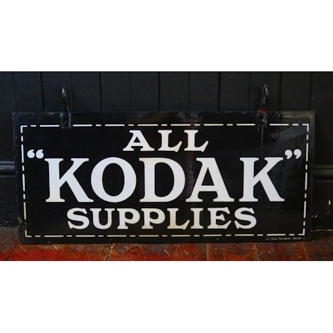"All Kodak Supplies" - an enamel hanging double-sided advert...