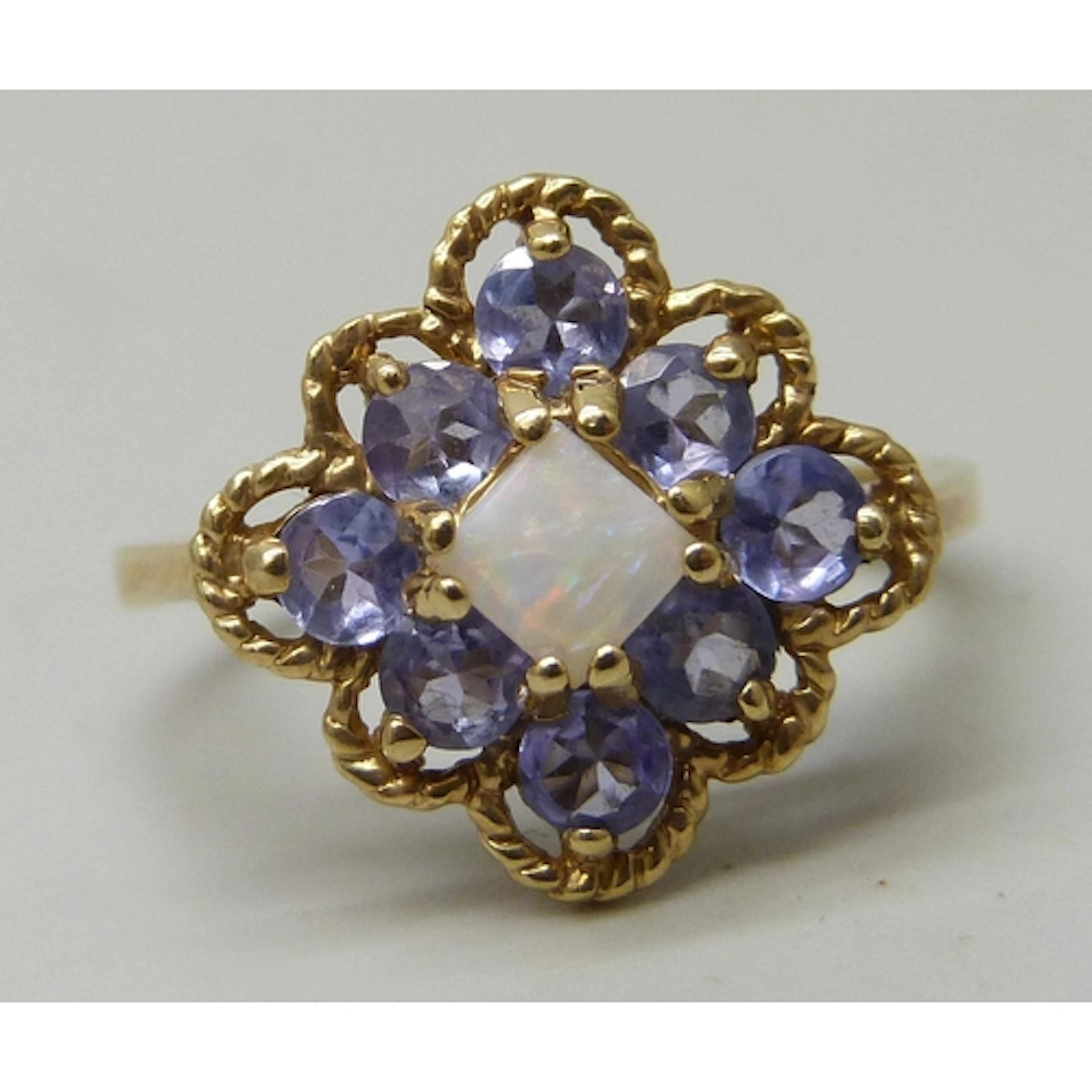 A 10K gold, opal and iolite cluster ring, 3.6g, N