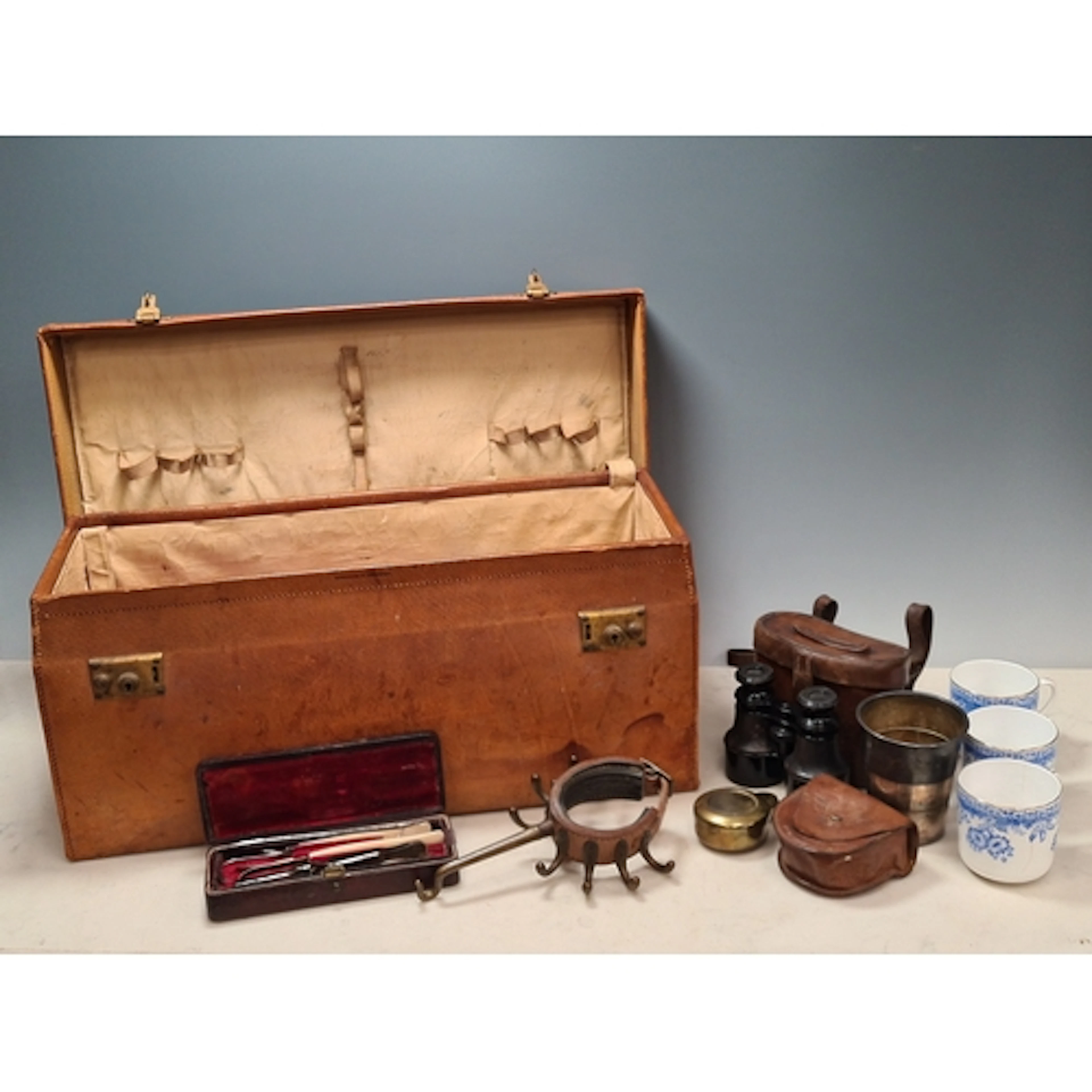 An antique leather Officer's Campaign Case containing a set ...
