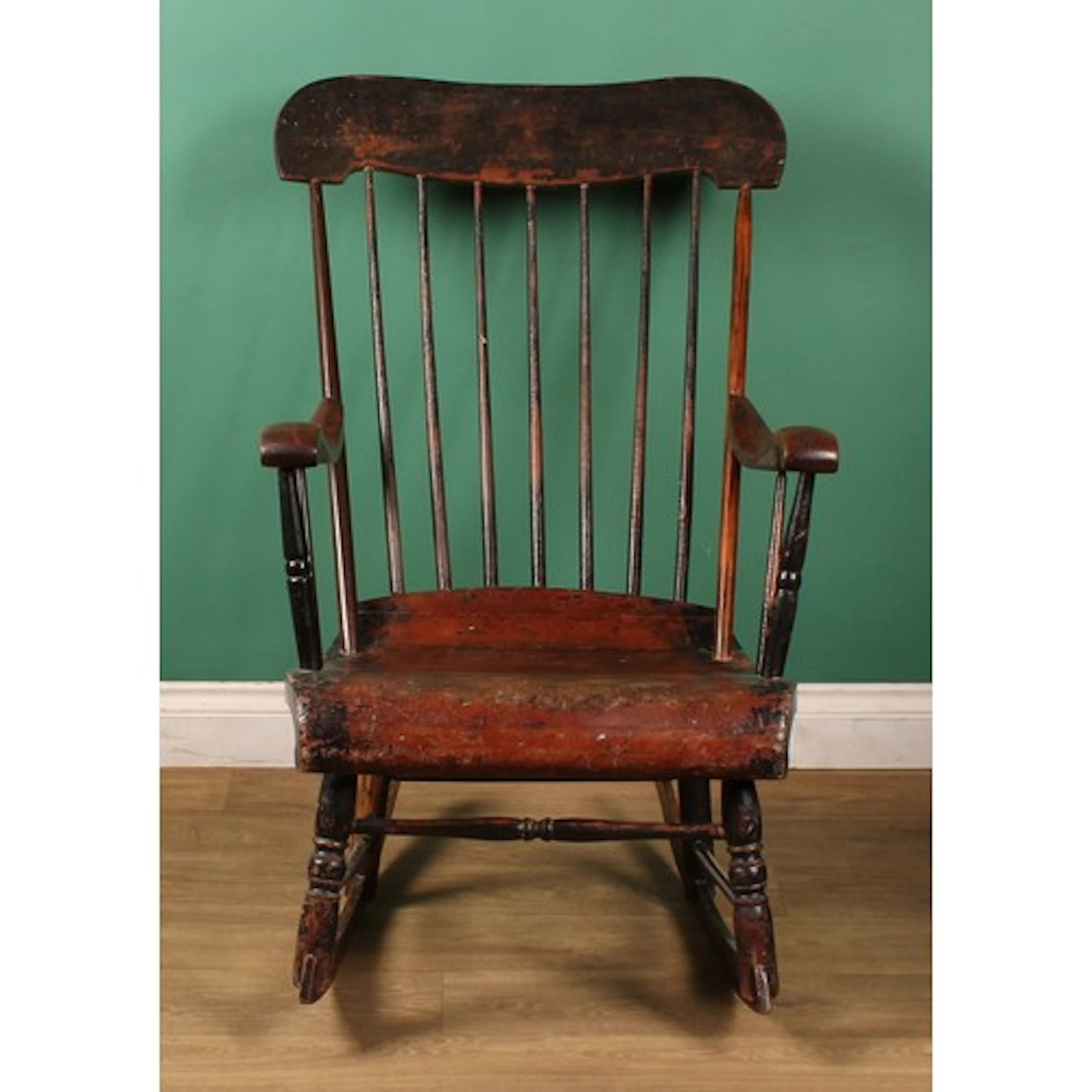 A 19th century American vernacular Windsor rocking chair, st...