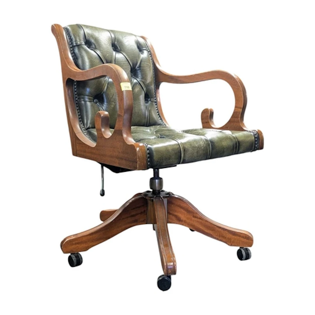 A vintage 20th century green Chesterfield button back office...