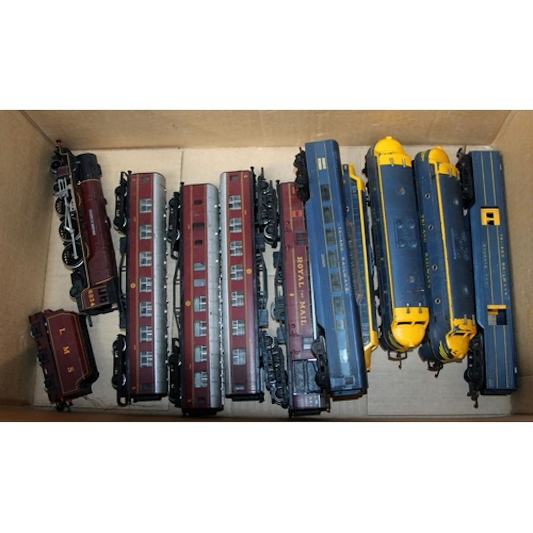 Two OO gauge locomotives with rakes of passenger coaches