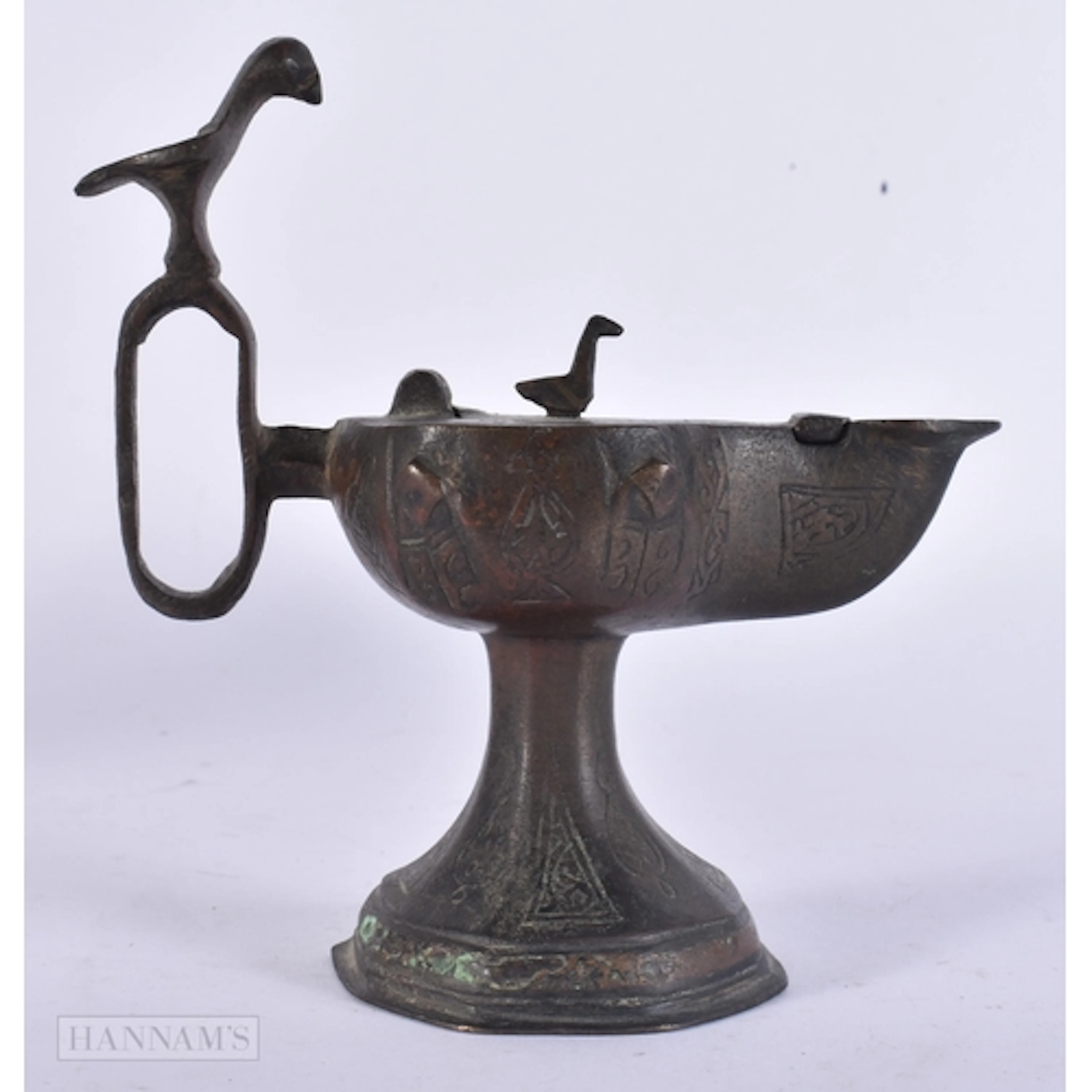 AN EARLY MIDDLE EASTERN PERSIAN KHOROSAN OIL BURNING LAMP. 1...