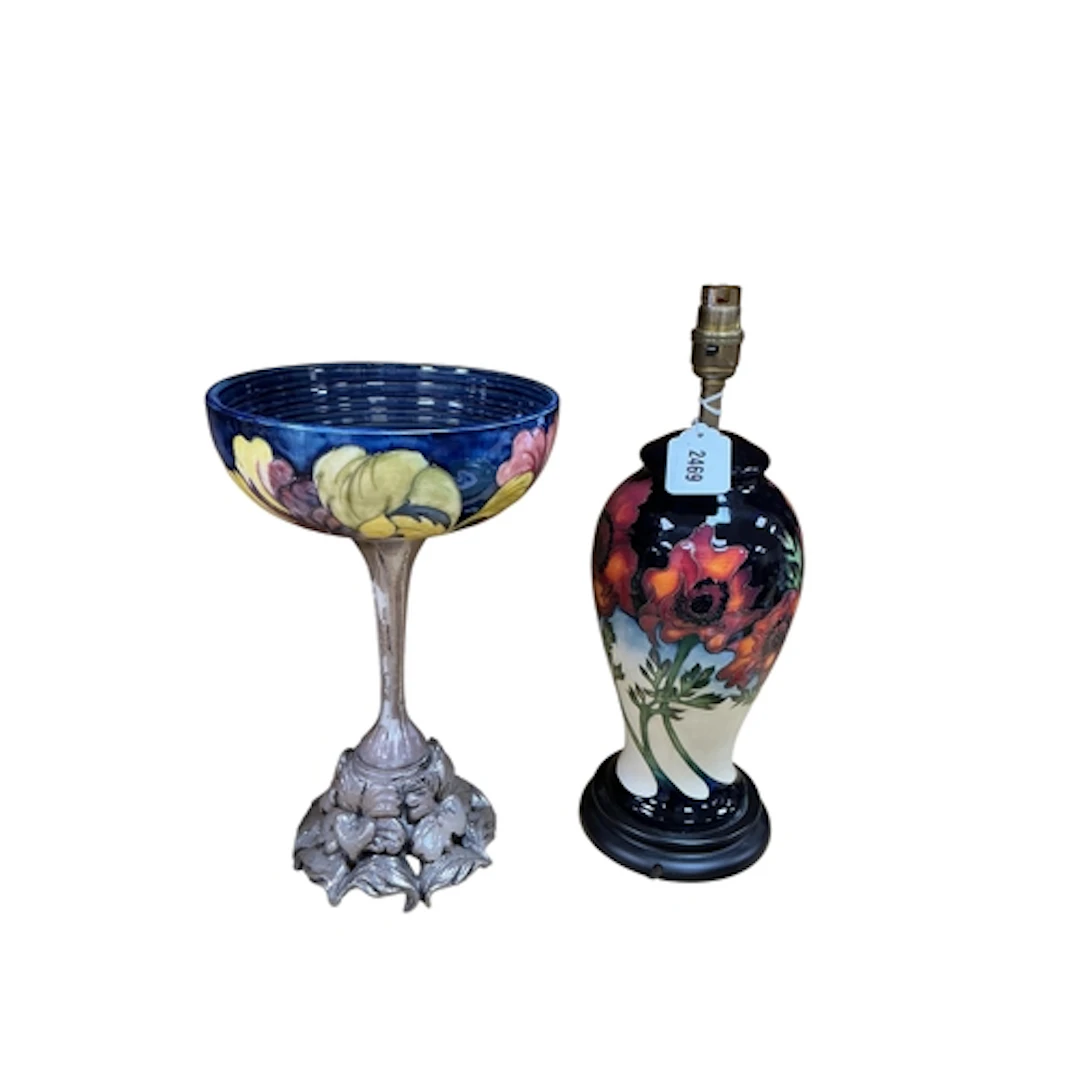 A Moorcroft pottery hibiscus tazza with silvered composition...