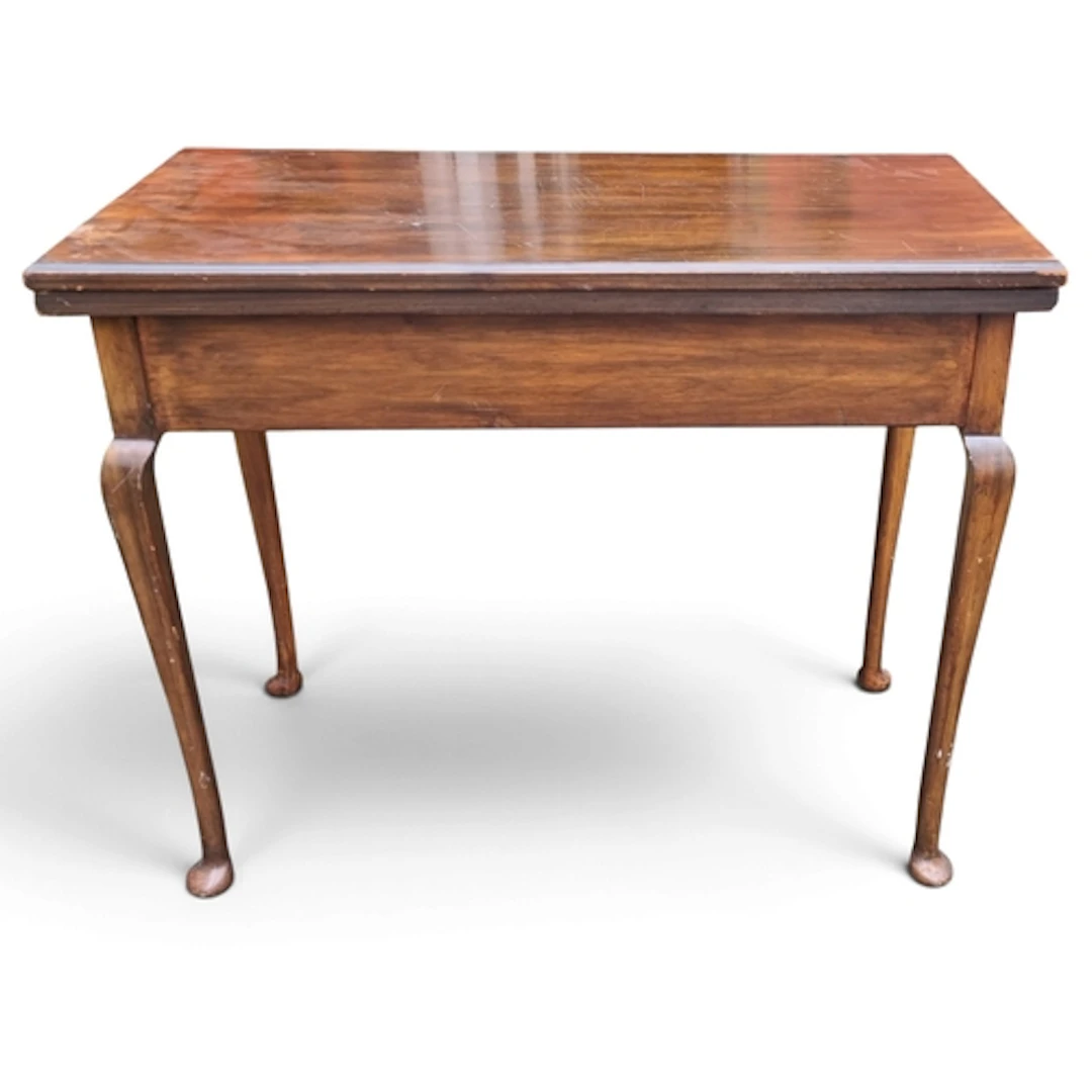 An early 20th Century fold over card table.