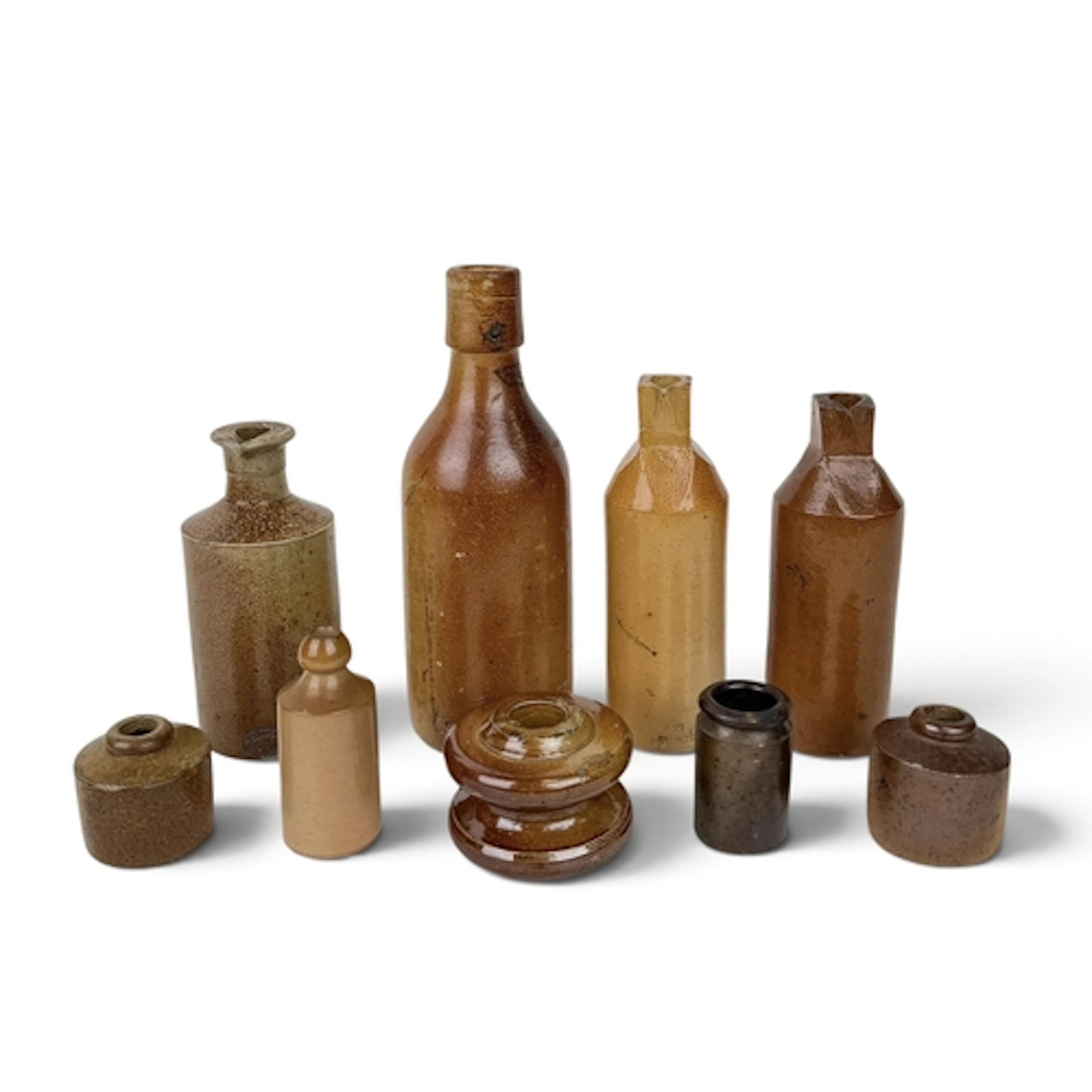 A GROUP OF ENGLISH 19TH CENTURY SALT-GLAZED STONEWARE BOTTLE...