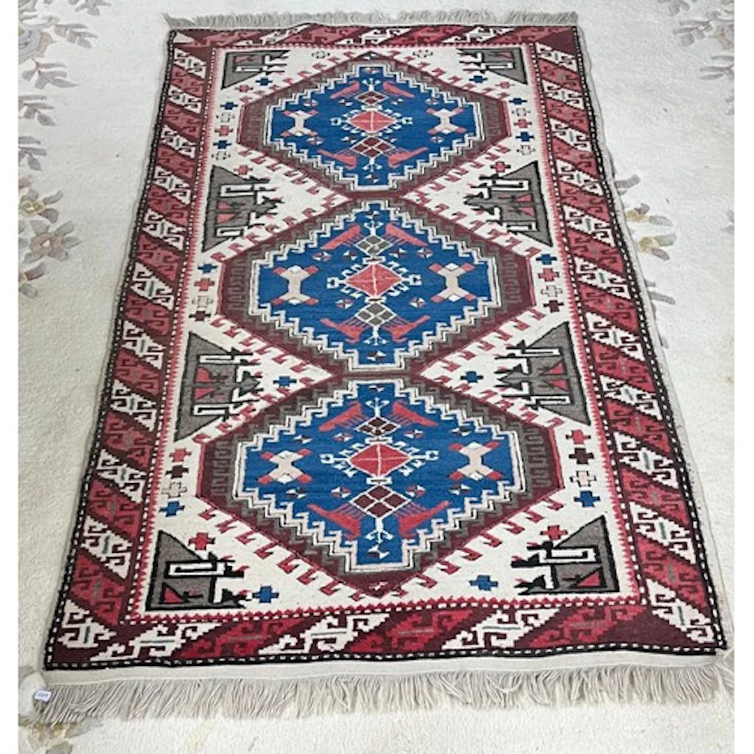 Blue and red patterned rug