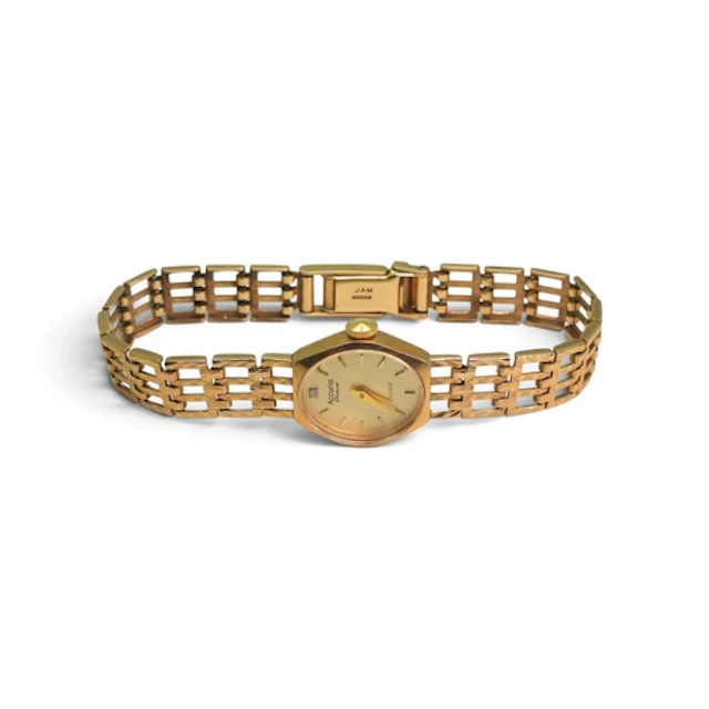 A 9ct gold Accurist ladies watch set with a diamond weight i...