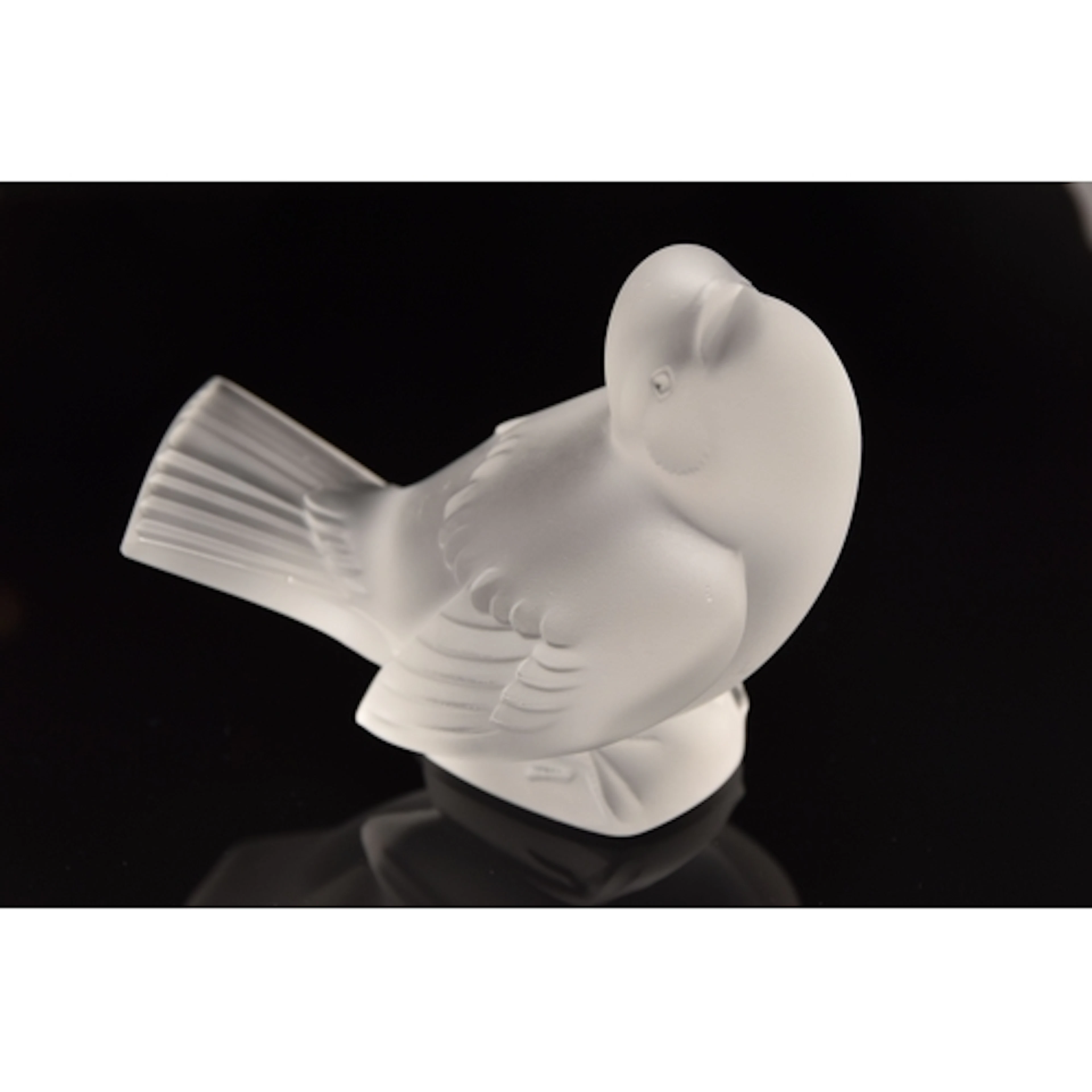 A LALIQUE 'MOINEAU MOQUEUR' OR MOCKING SPARROW FIGURE, the f...