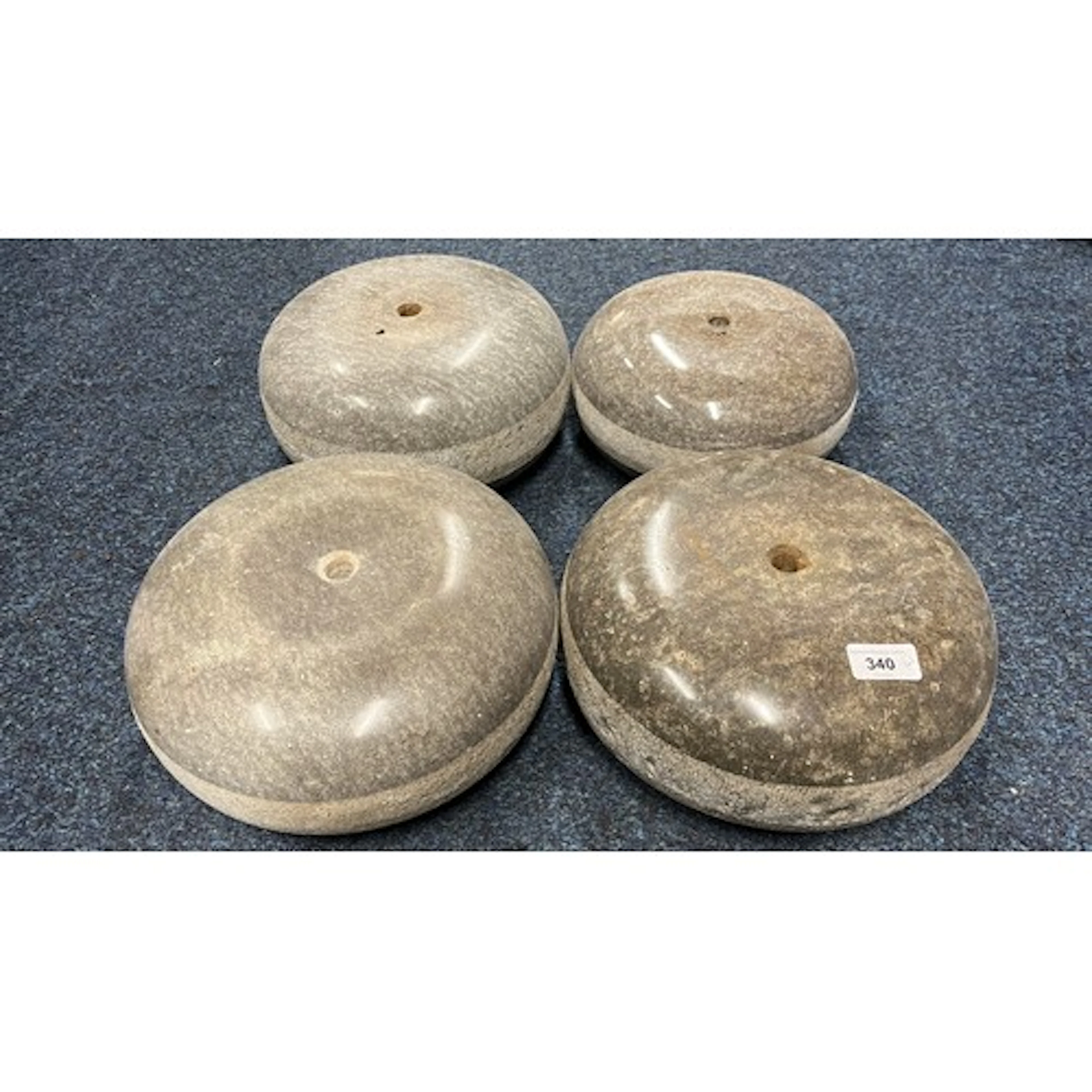 Group of four curling stones.