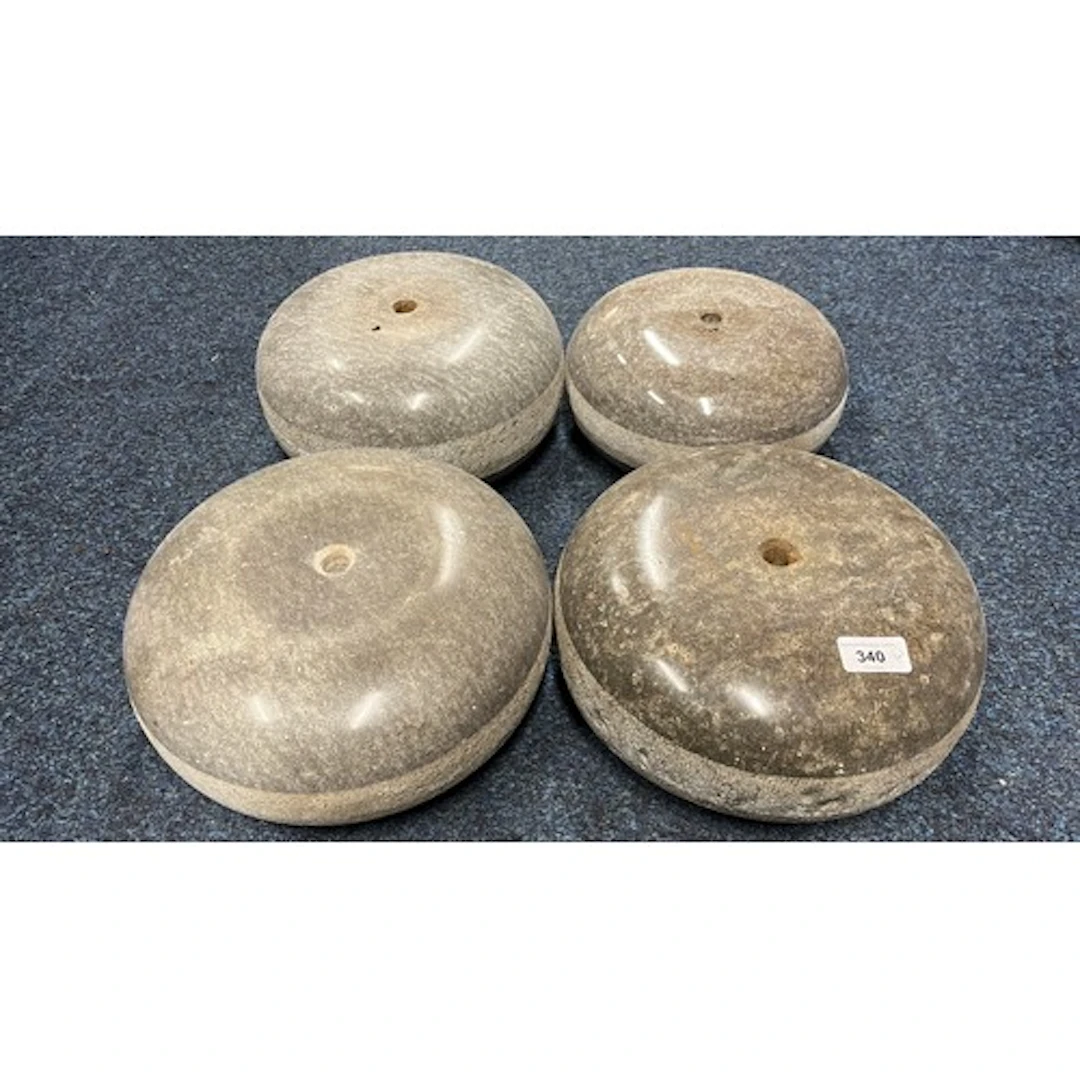 Group of four curling stones.