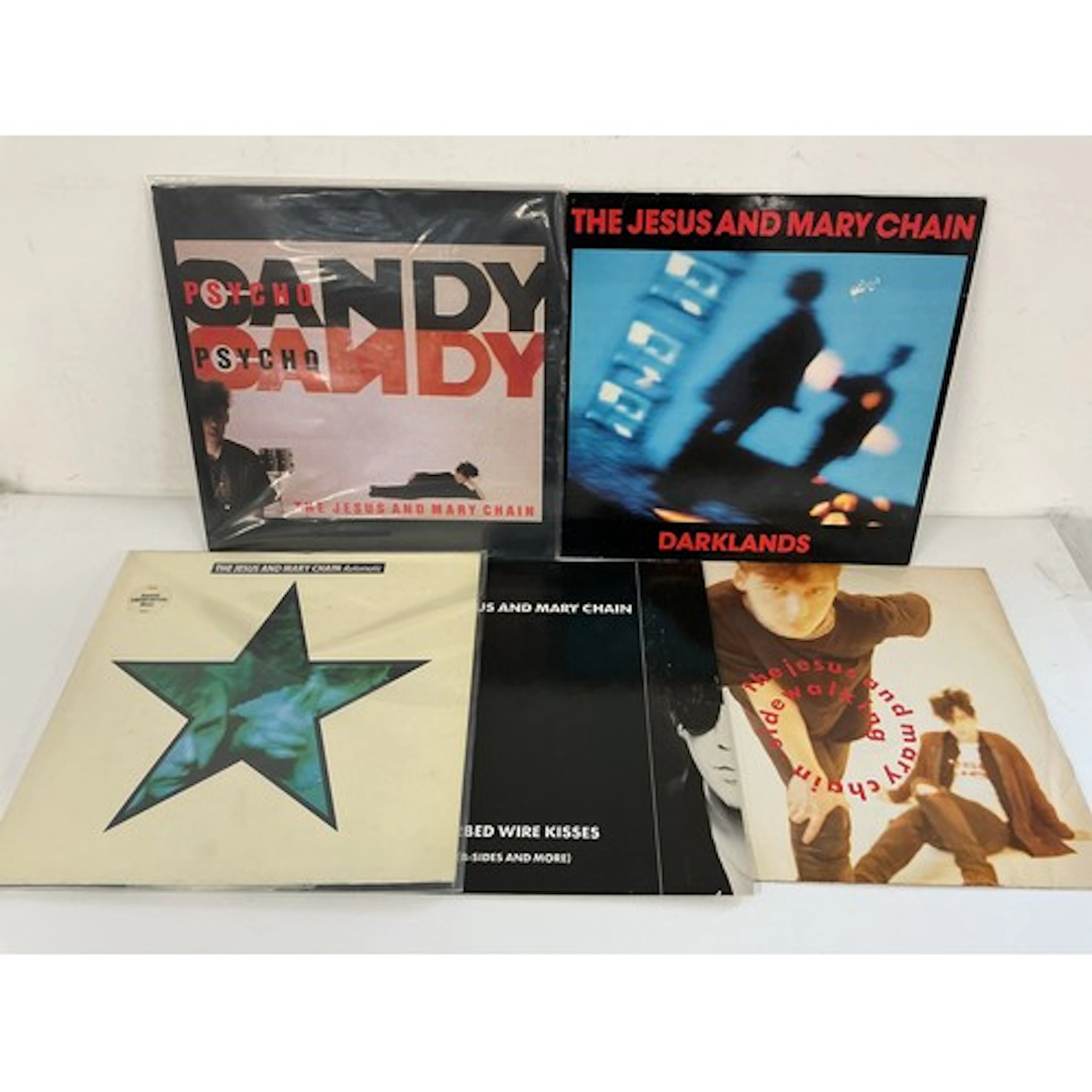 Four Jesus & Mary Chain LPs and a 12” single compr...