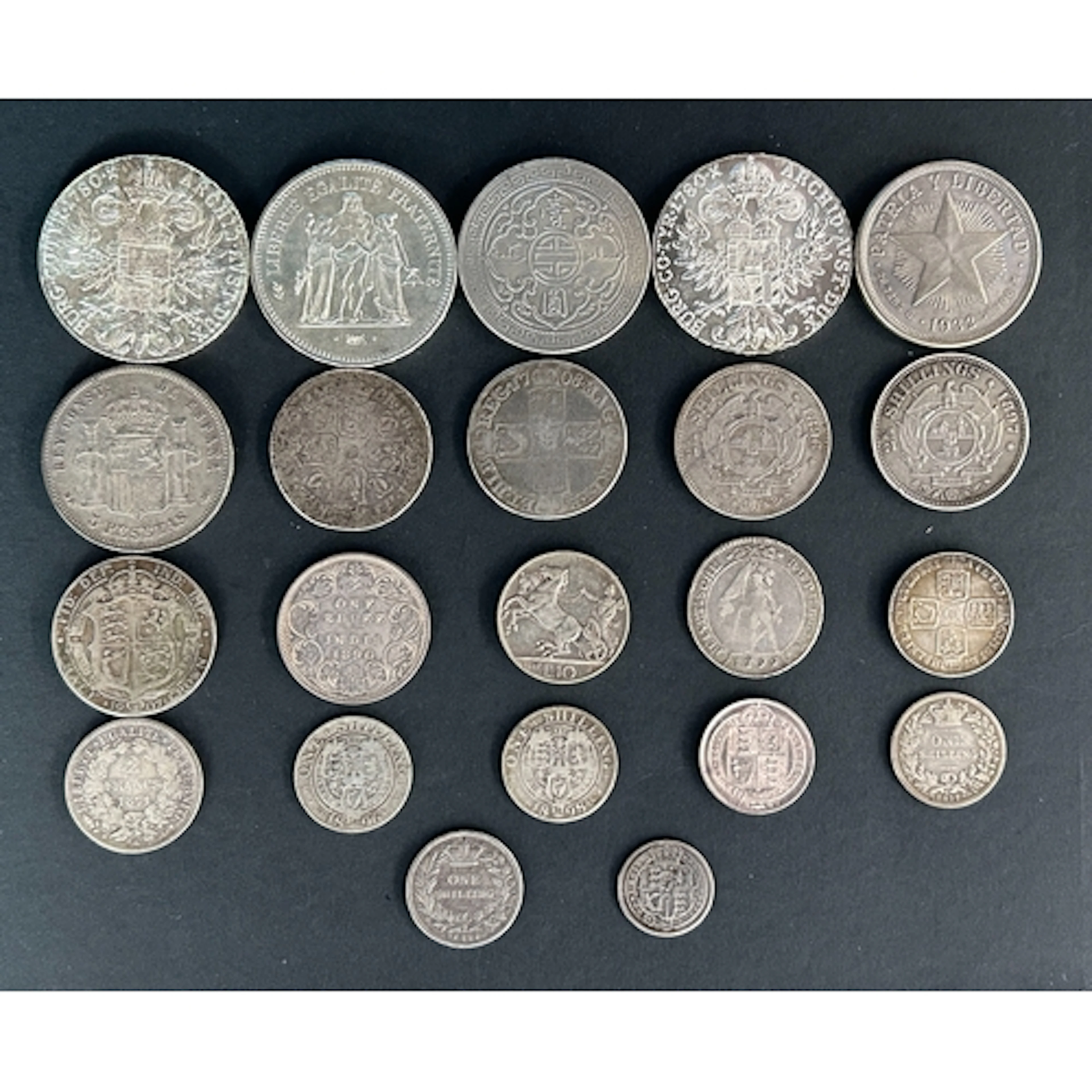 A group of twenty-two World silver coins, mainly 19th and 20...
