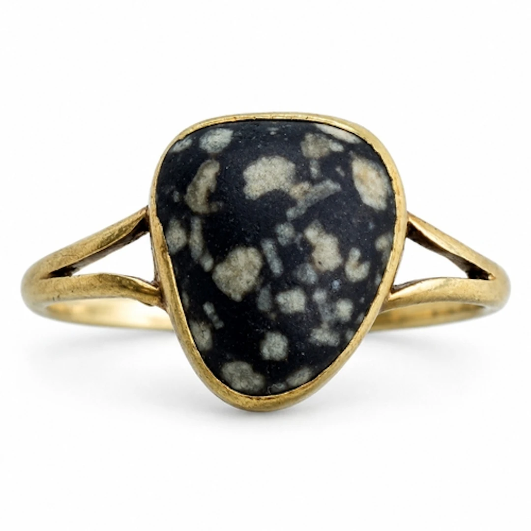 An unusual Victorian 15ct gold ring set with a large polishe...