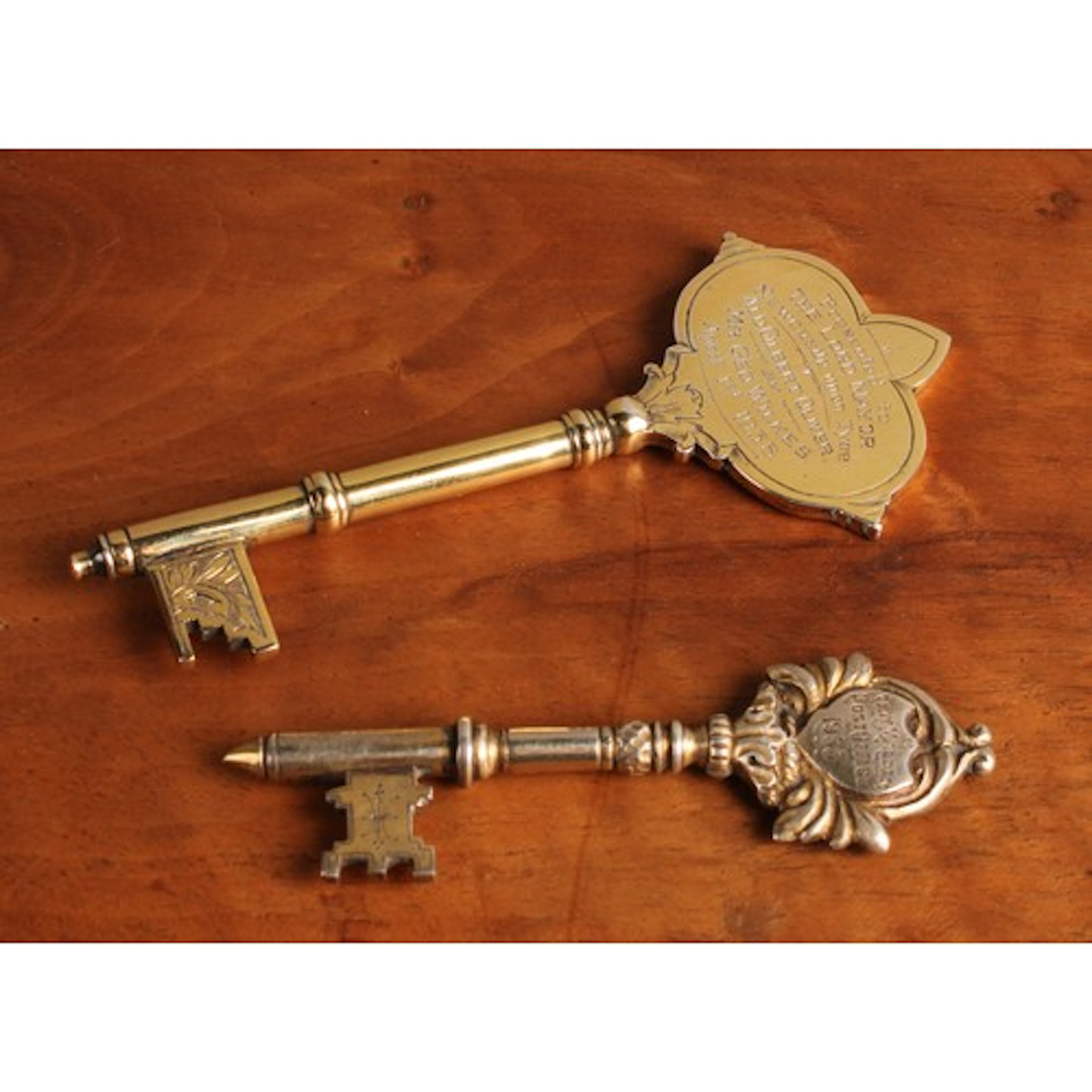 A George V silver-gilt presentation key, inscribed 'Presente...