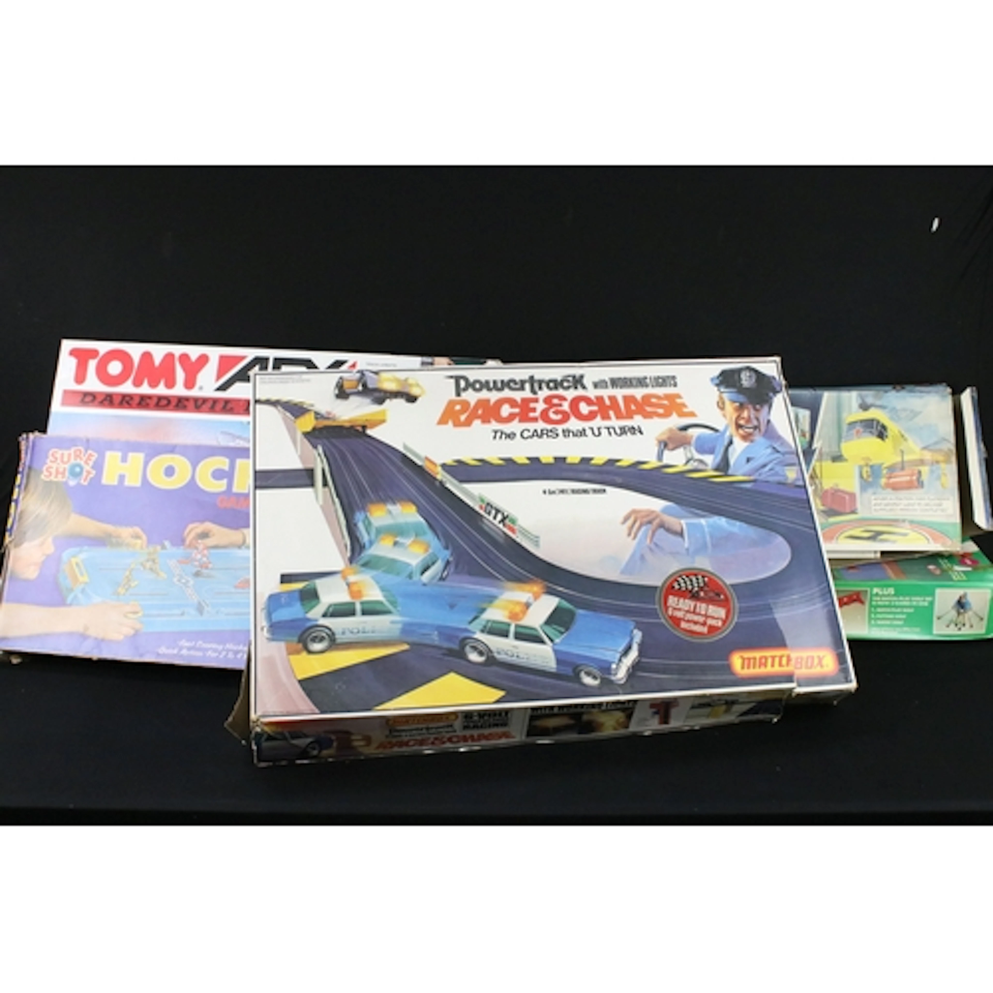 Five boxed toys / games to include Matchbox Powertrack PT600...