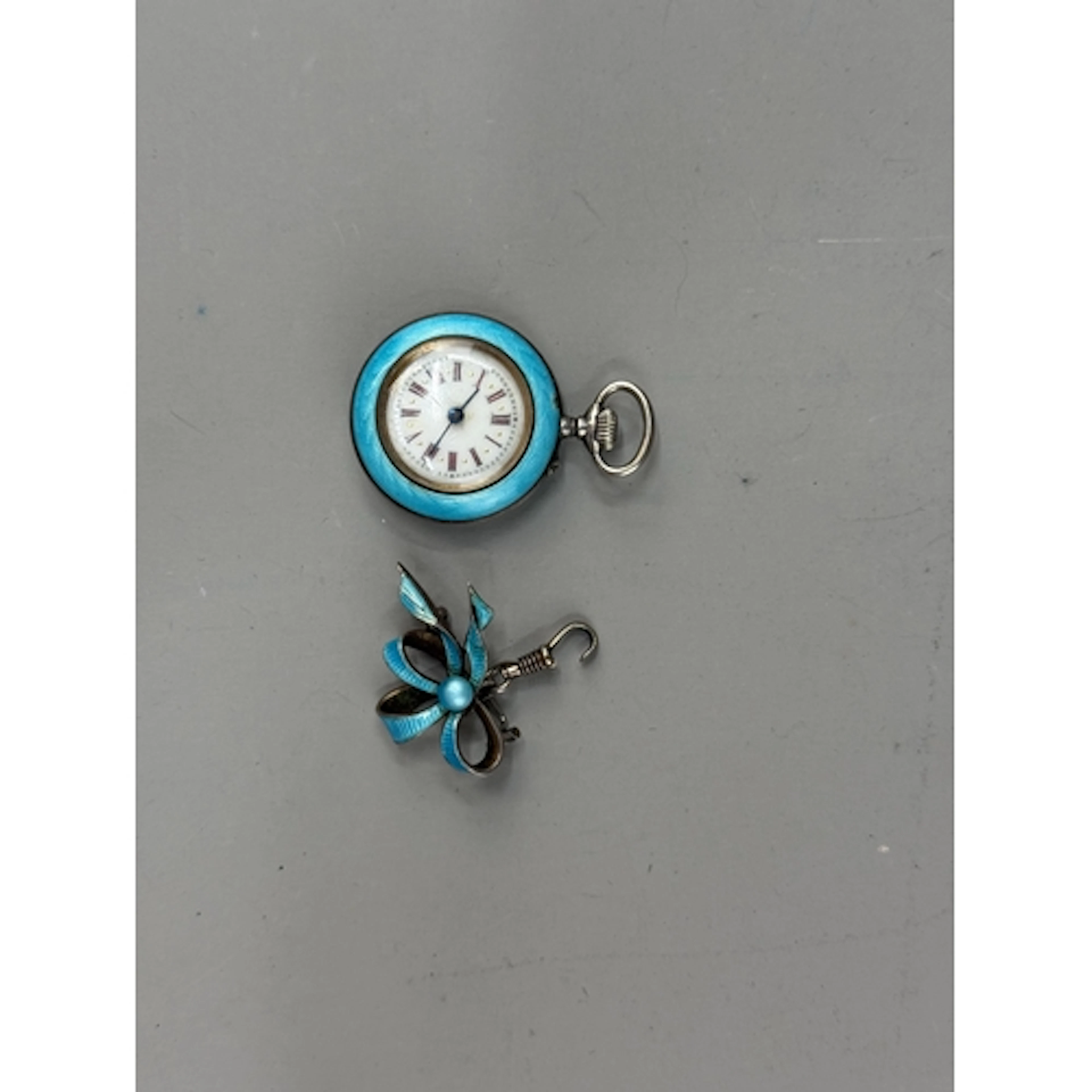 Watches: a ladies pin set silver and pale blue guilloche ena...