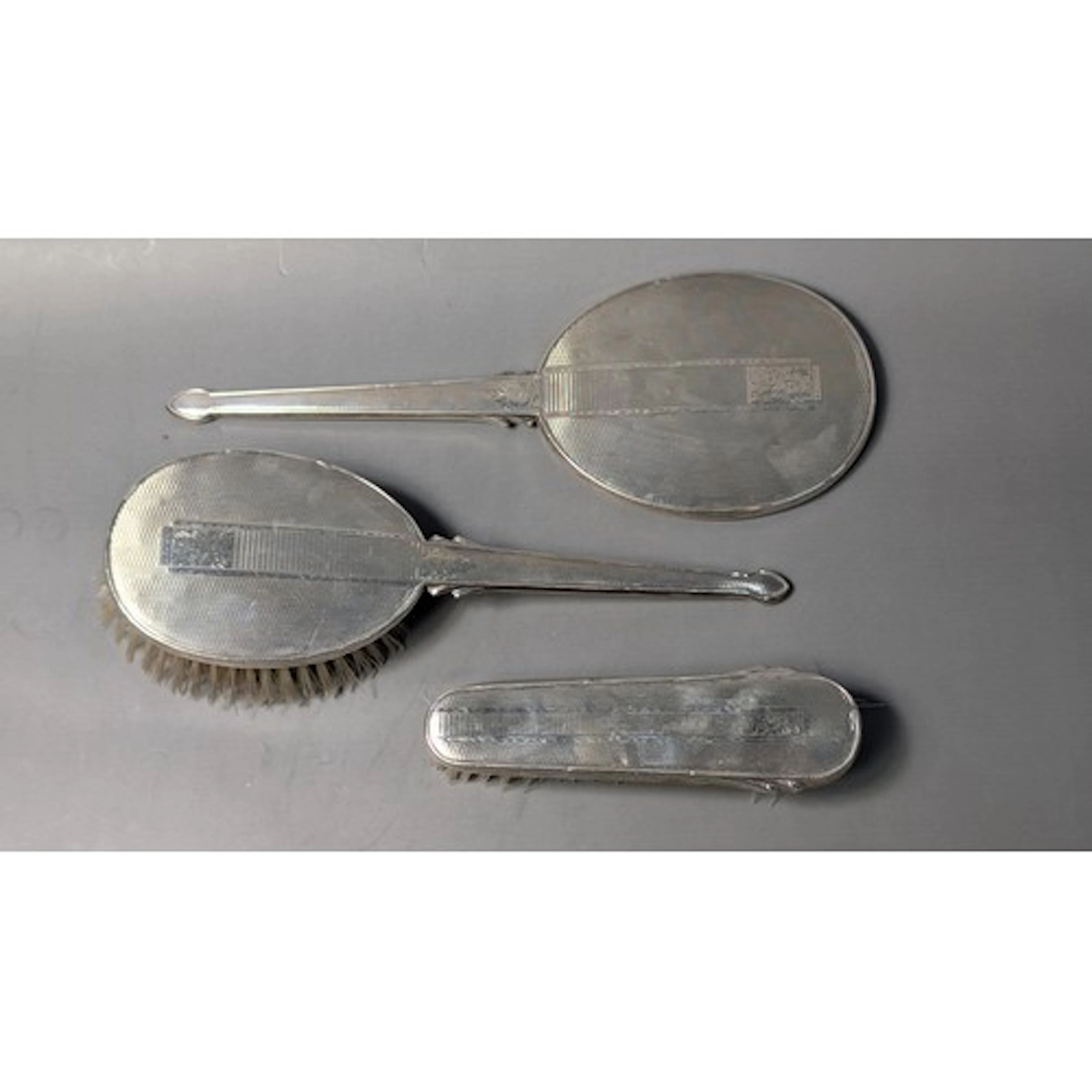 Elizabeth II silver mounted three-piece dressing table set, ...