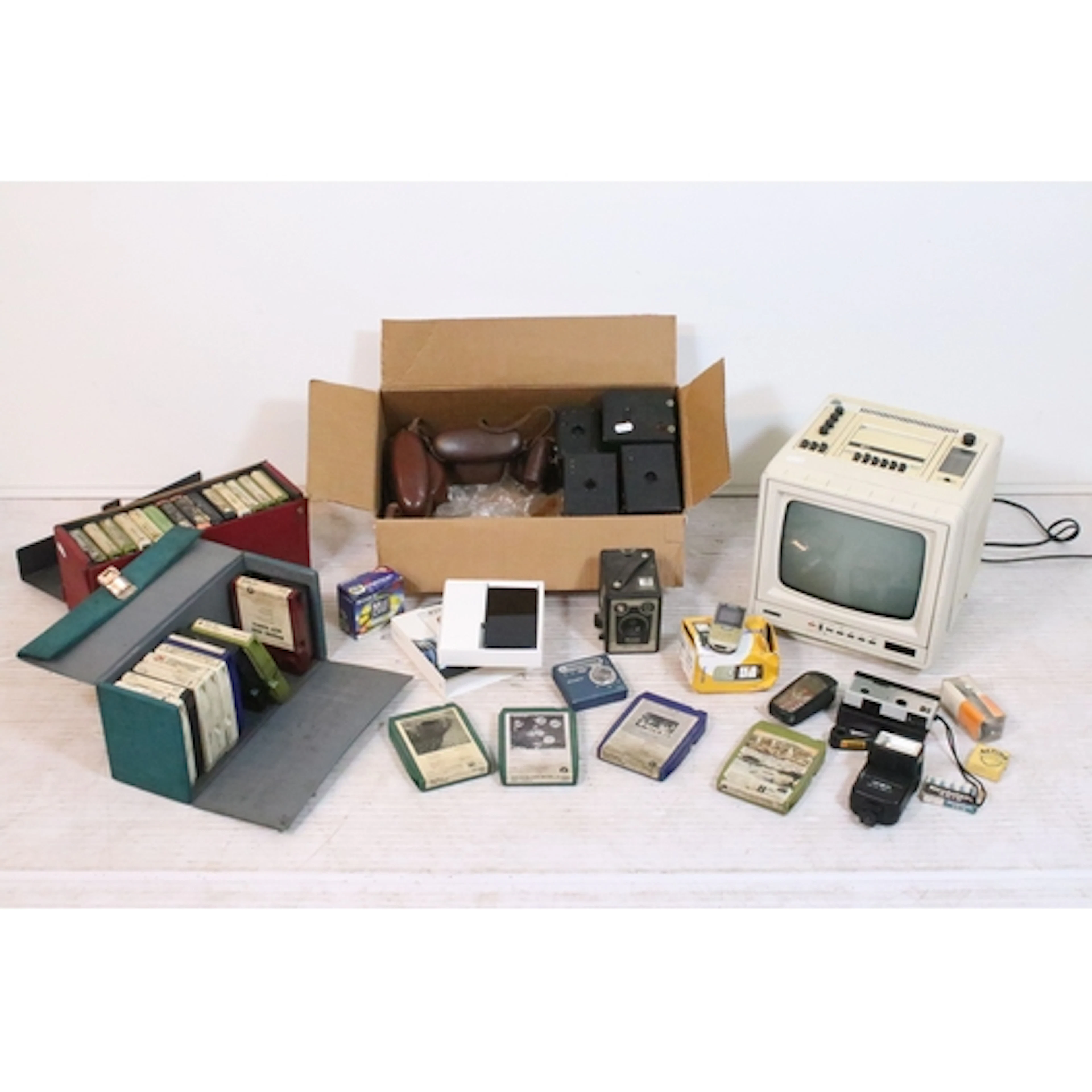 Collection of cameras and phones, to comprise Brownie camera...