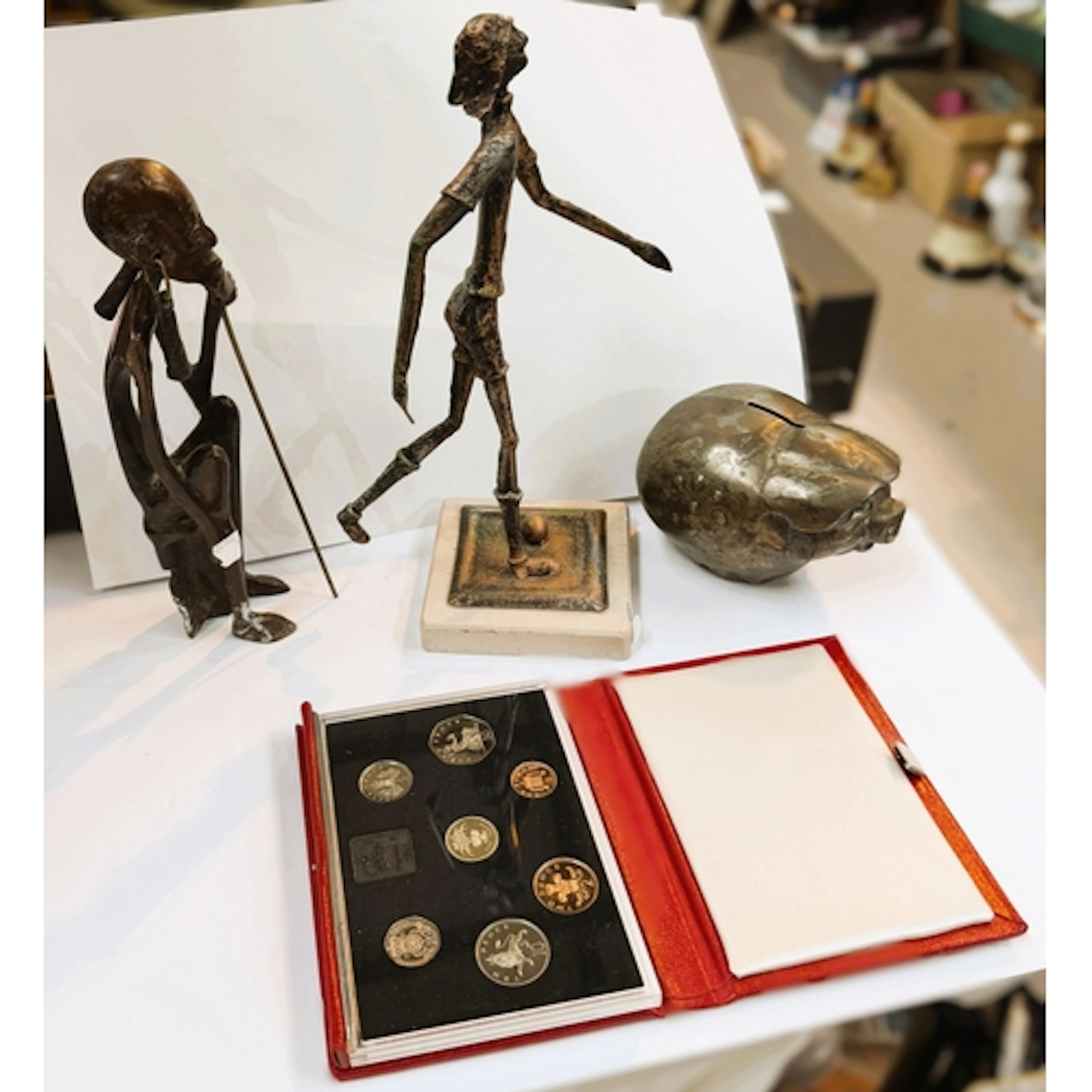 A modern copper effect textured metal figure, the 'Walking M...