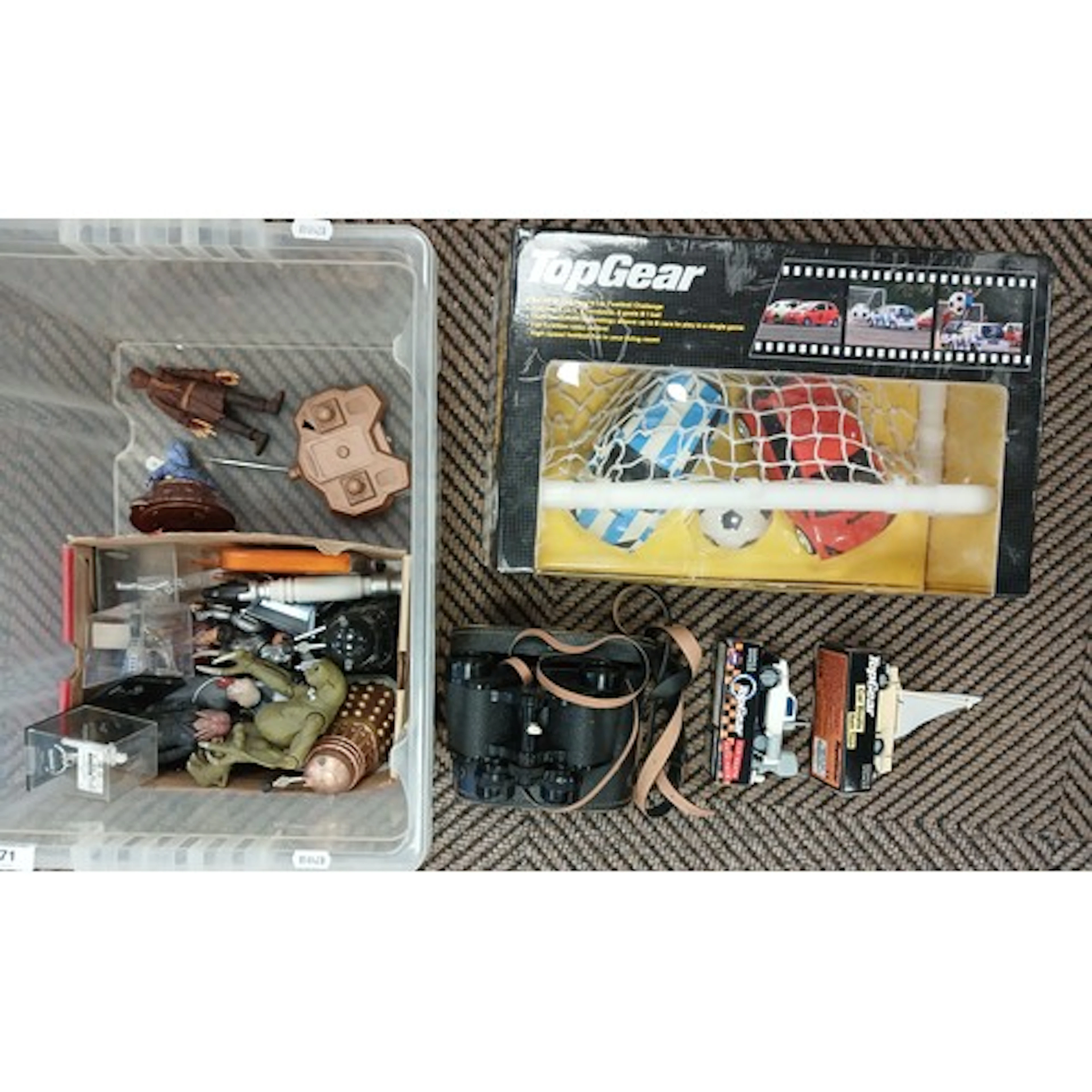 Box of assorted childrens toy figures, cars, binoculars etc.