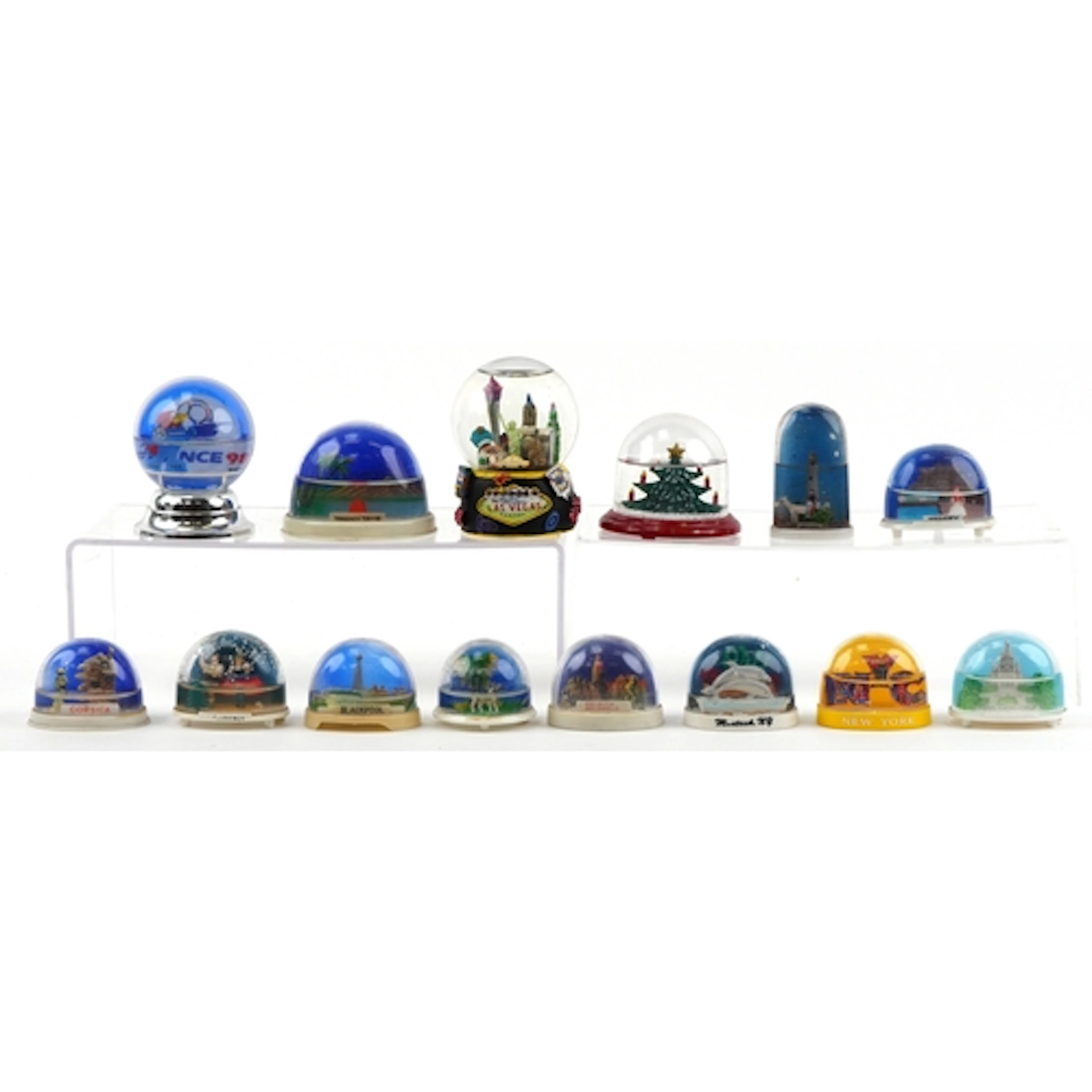 Collection of snow globes including Christmas examples, Trin...