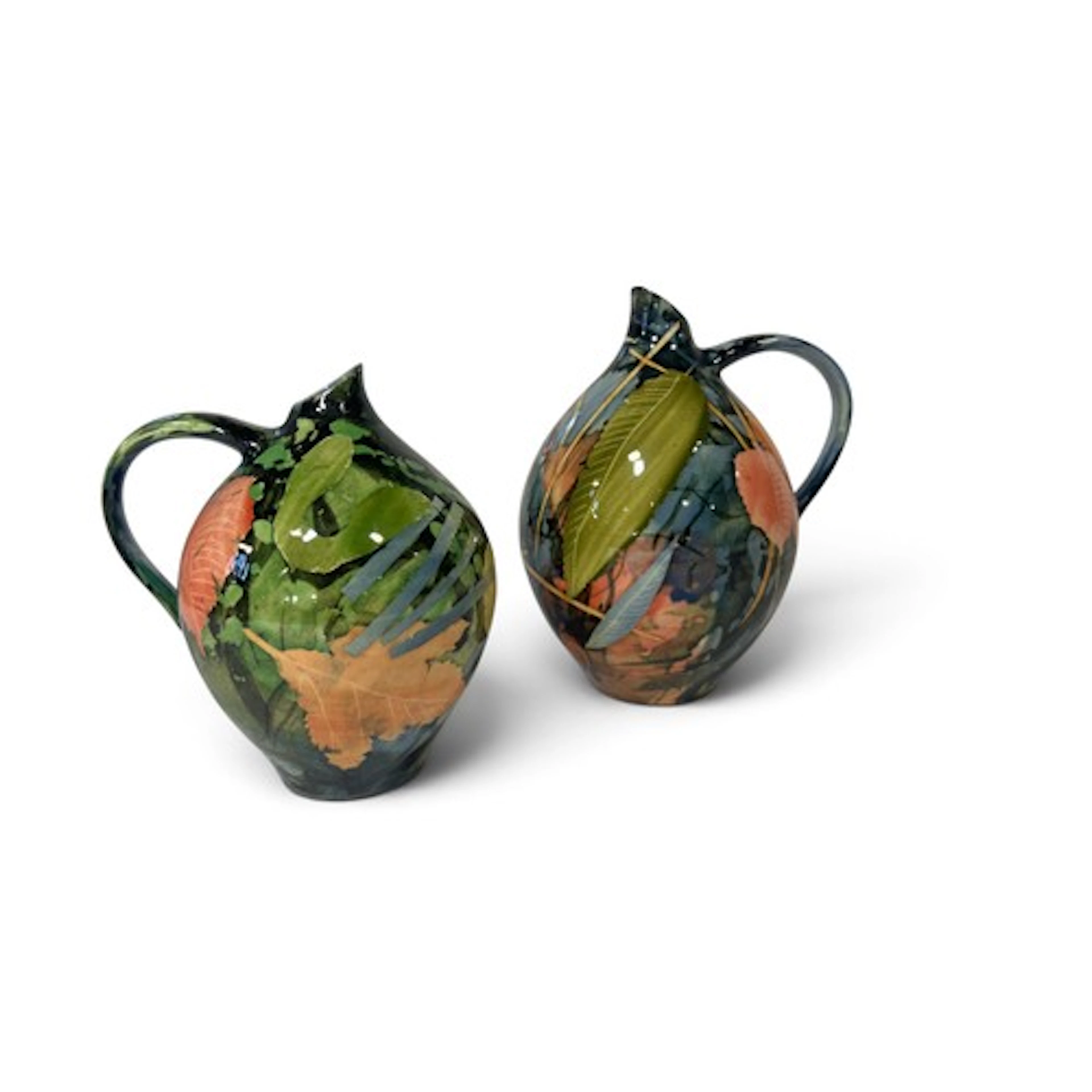 Two graduated oil jars with colourful abstract leaf decorati...