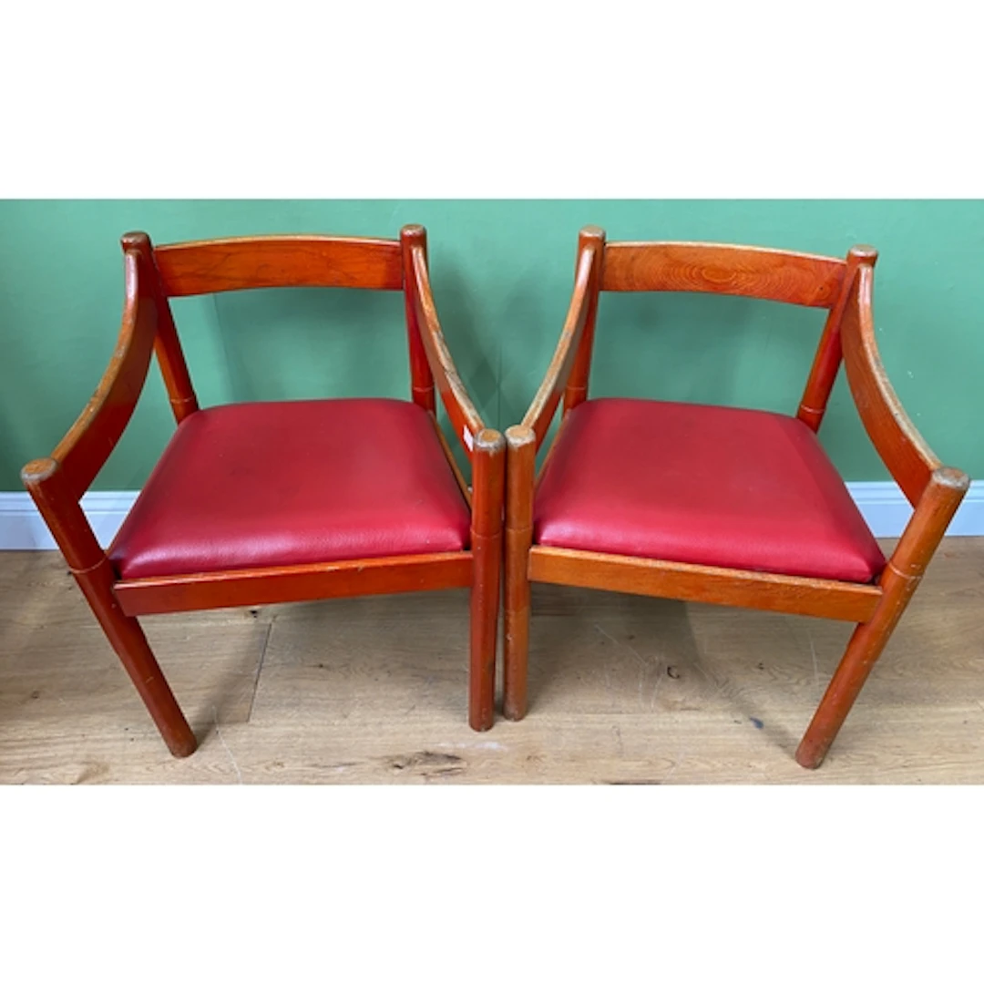 A pair of red stained Carimate open armchairs by Vico Magist...