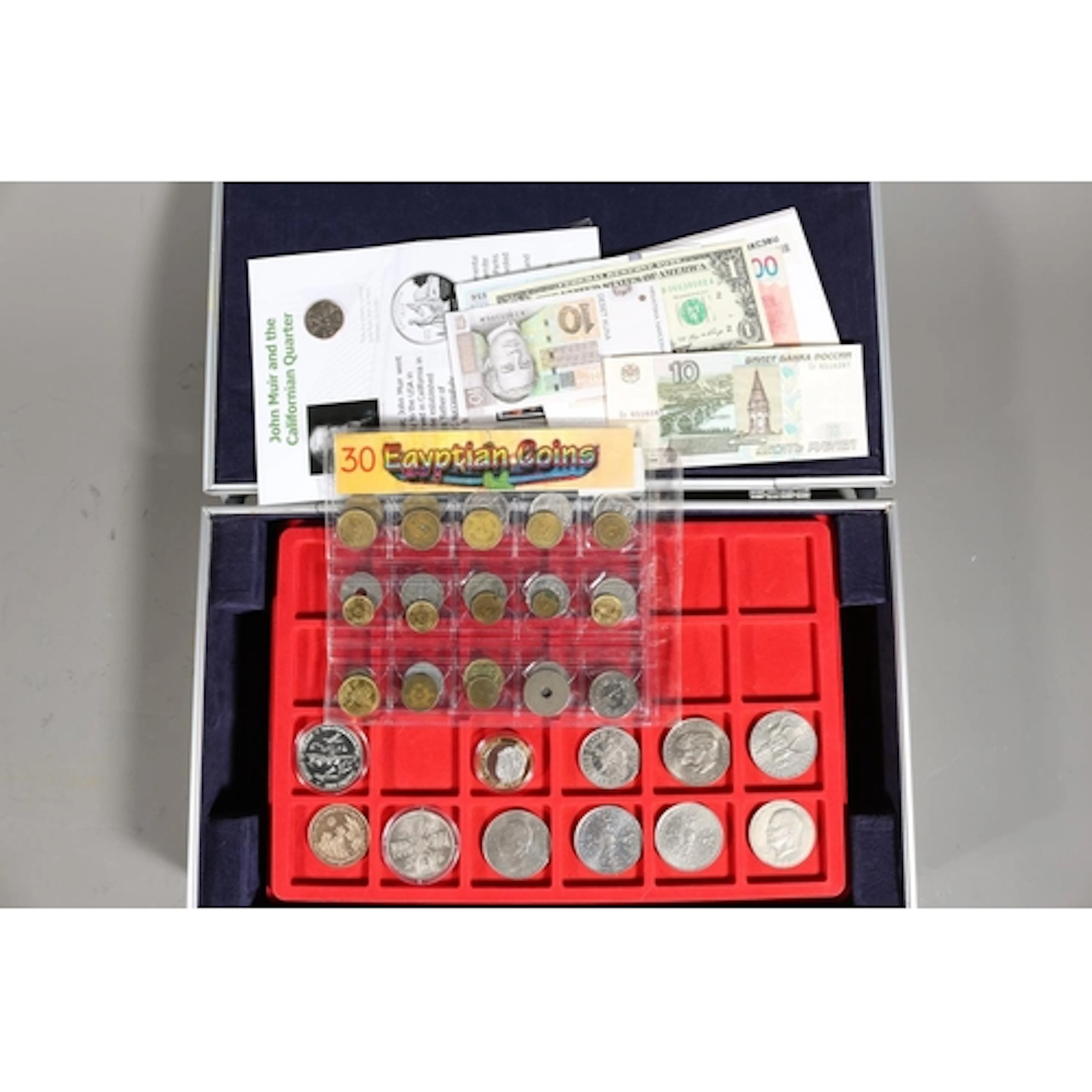 Coin and banknote collection held in a aluminium clad case i...