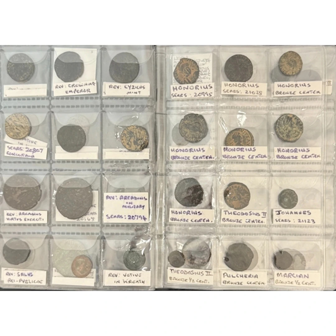 A coin album containing 74 Roman bronze coins, noted Valenti...